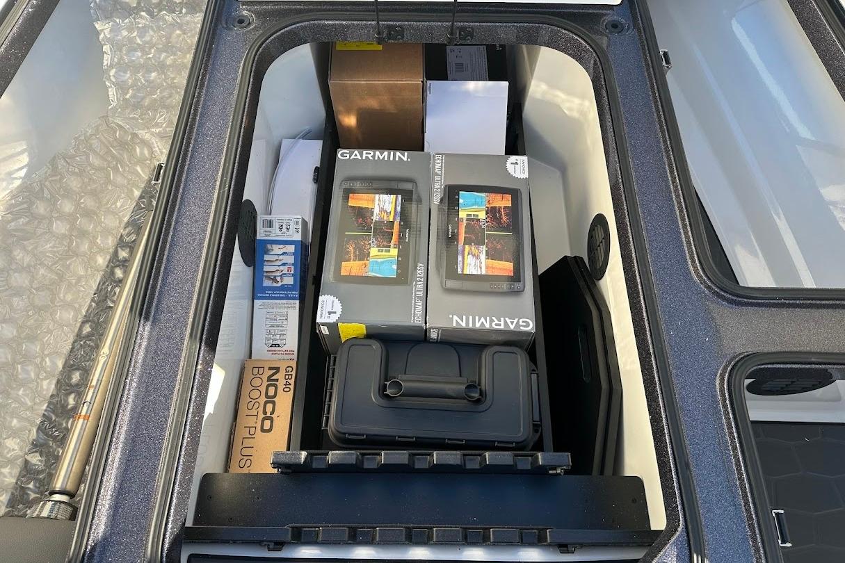 Storage compartment of 2026 Ranger Z521R with Garmin equipment and accessories.
