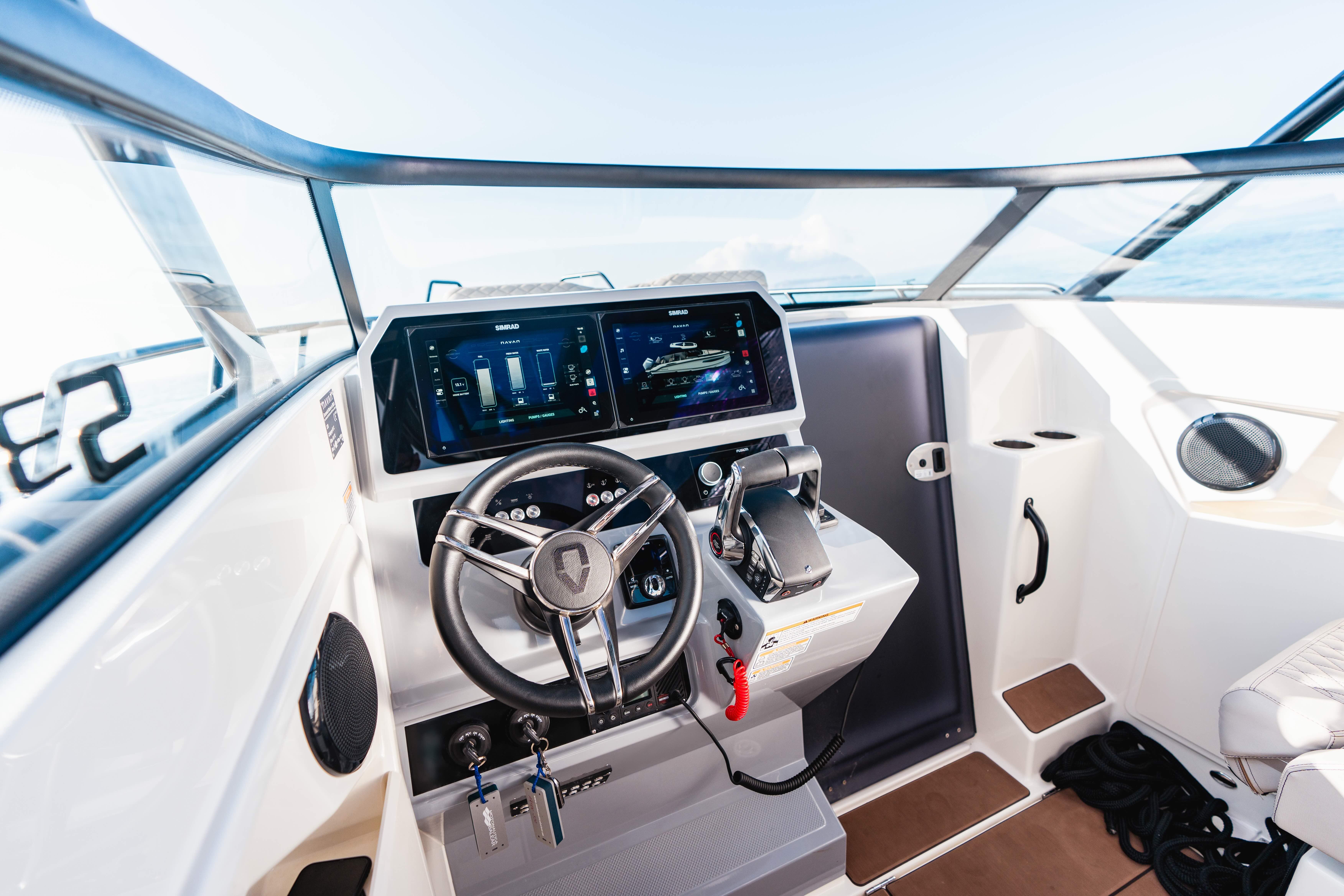 2025 Navan S30 boat cockpit with modern steering and digital controls.