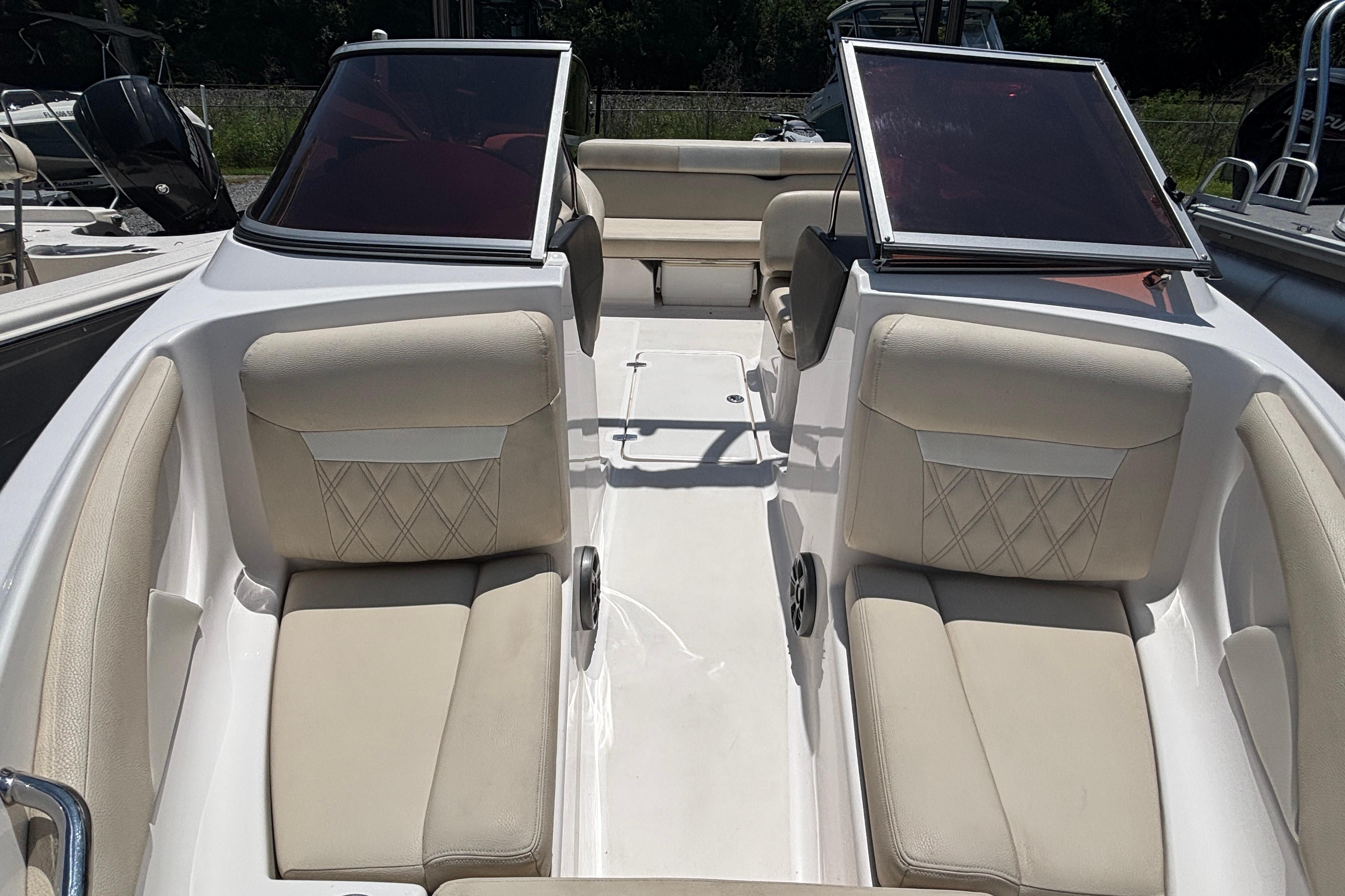2018 Regal 1900 ES Bowrider interior with beige seating and open windshield.