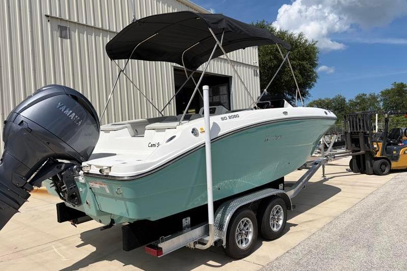 2026 Hurricane SunDeck Sport 2050 OB boat on trailer, with Yamaha outboard motor.
