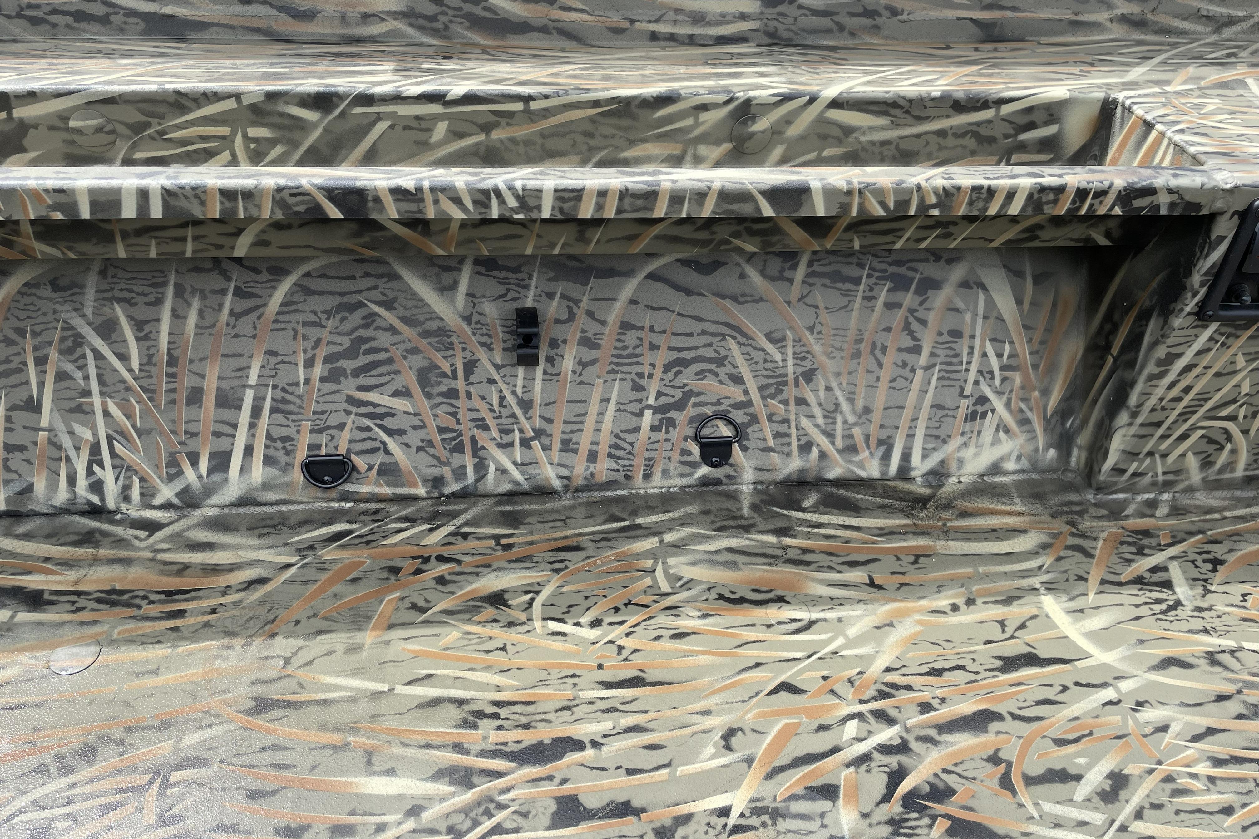 2026 Tracker Grizzly 1756 T Marsh boat interior with camouflage pattern design.