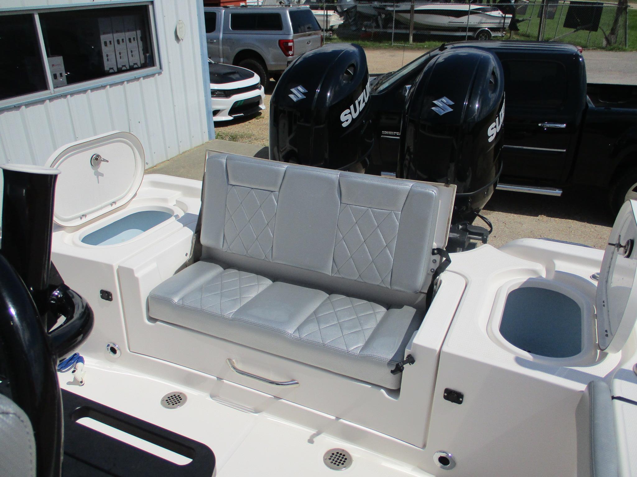 2024 Blue Wave 2800 Makaira boat with dual Suzuki engines and cushioned seating.
