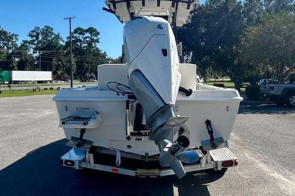2026 Ranger 2360 Bay boat, rear view with outboard motor, parked outdoors.