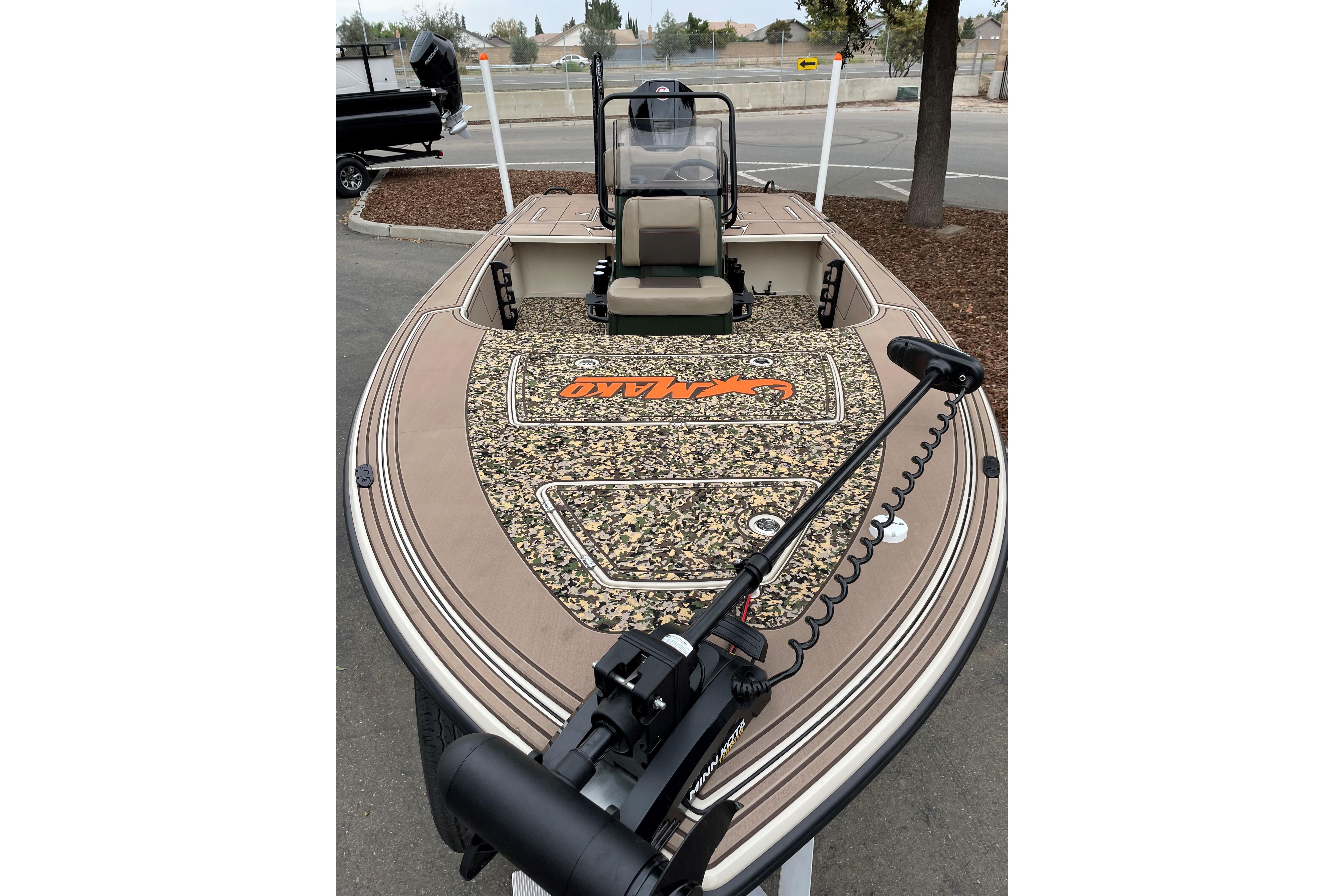 2025 Mako 18 Pro Skiff Backwater Edition with camo deck and trolling motor.