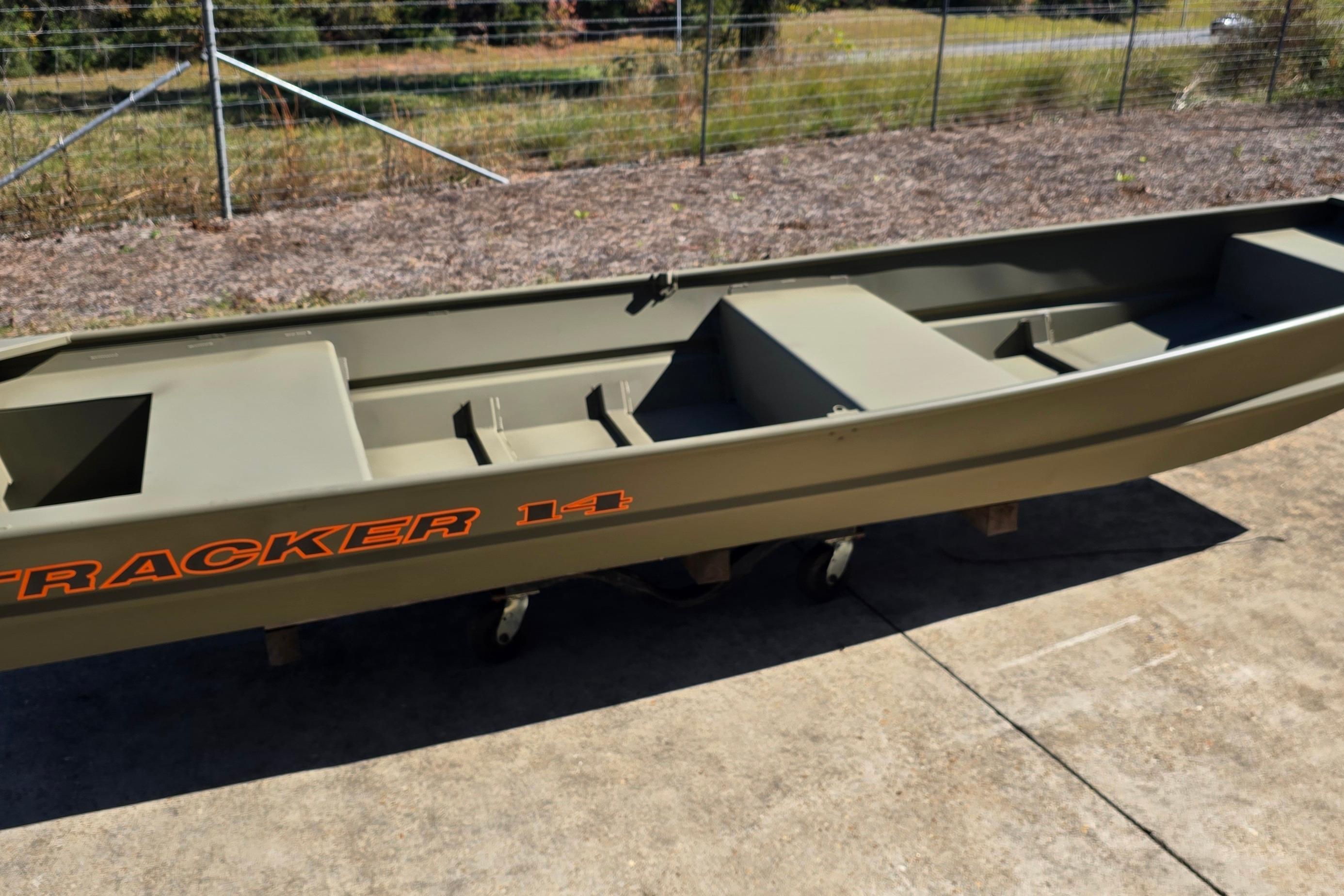 2026 Tracker Grizzly 14 Jon boat on concrete surface, outdoors.