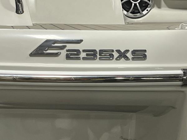 2023 Crownline Eclipse E235 XS boat emblem on white surface.