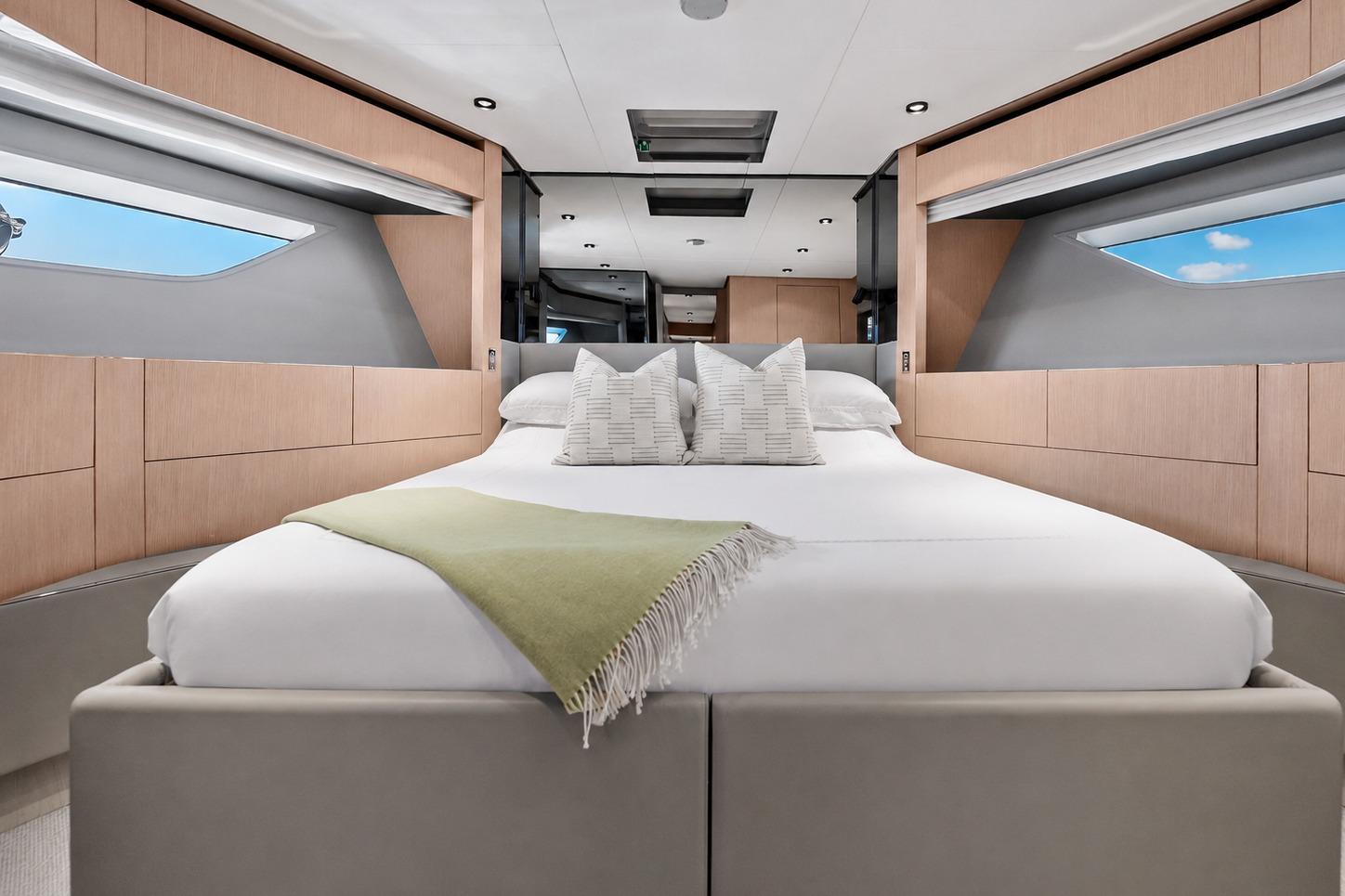 Luxurious bedroom interior of 2022 Ferretti Yachts 780 with modern design and elegant decor.