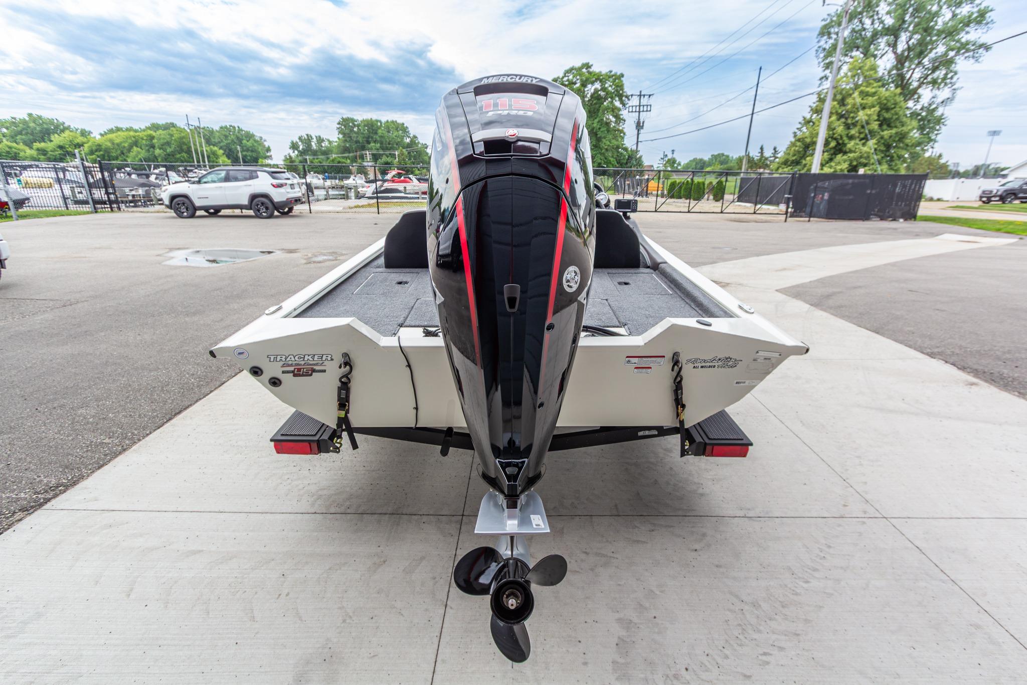 2023 Tracker Pro Team 190 TX boat with powerful outboard motor, parked outdoors.
