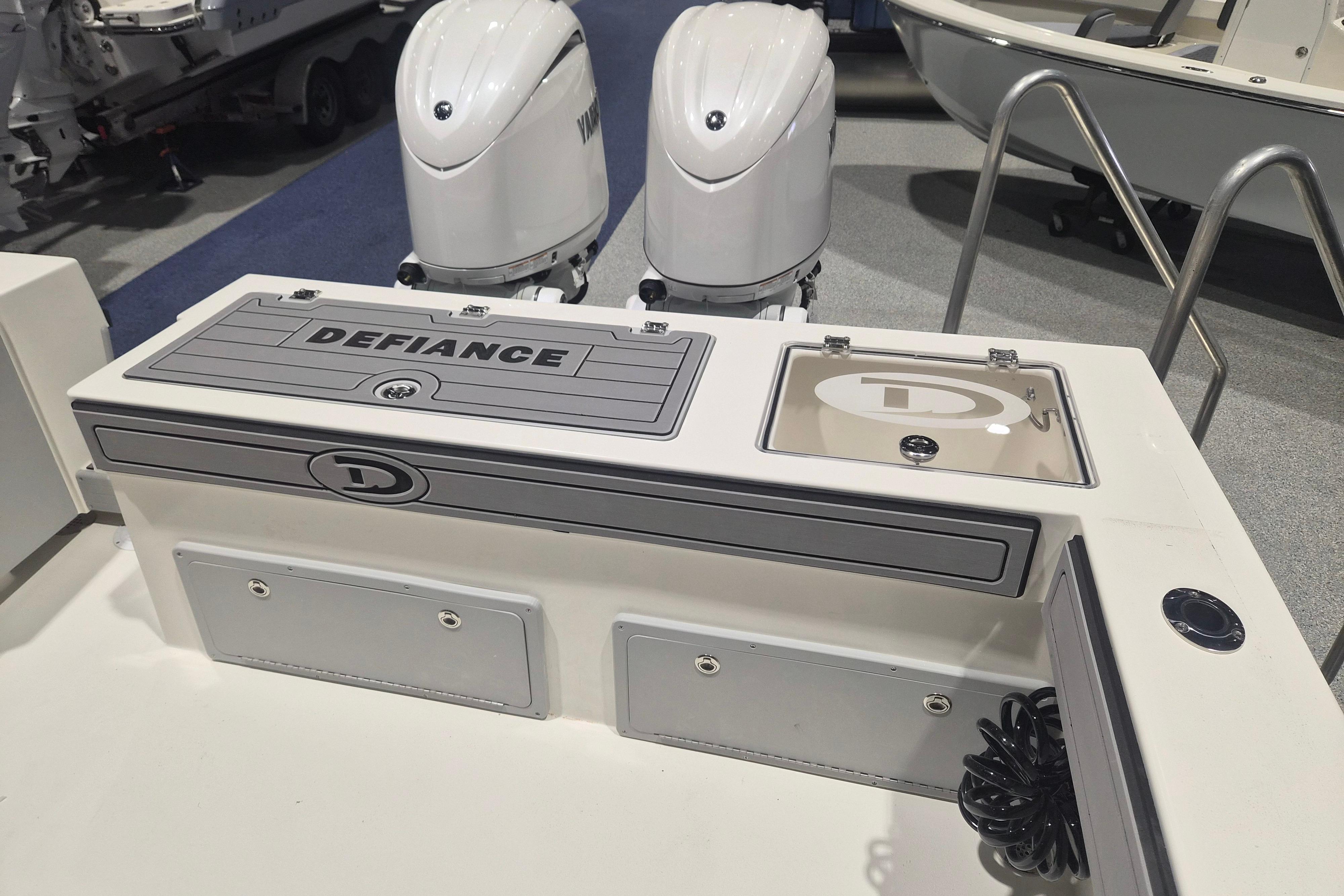 2026 Defiance Admiral 260 EX boat deck with dual engines and storage compartments.