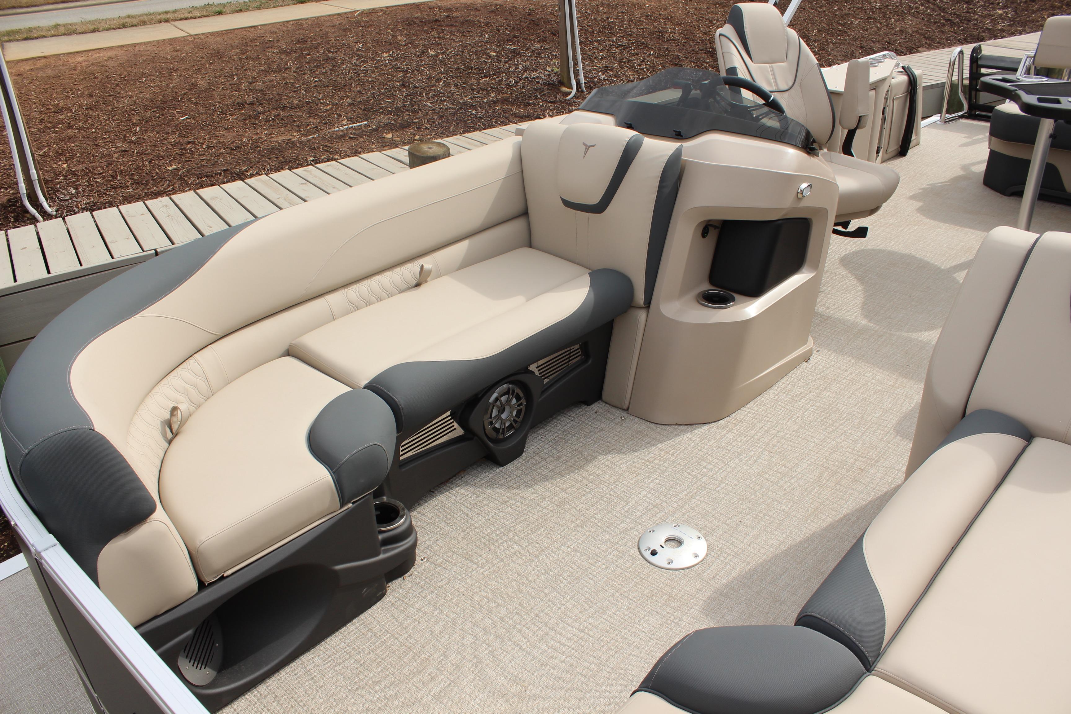 2026 Tahoe Pontoon LTZ interior with beige and gray seating, showcasing luxury and comfort.