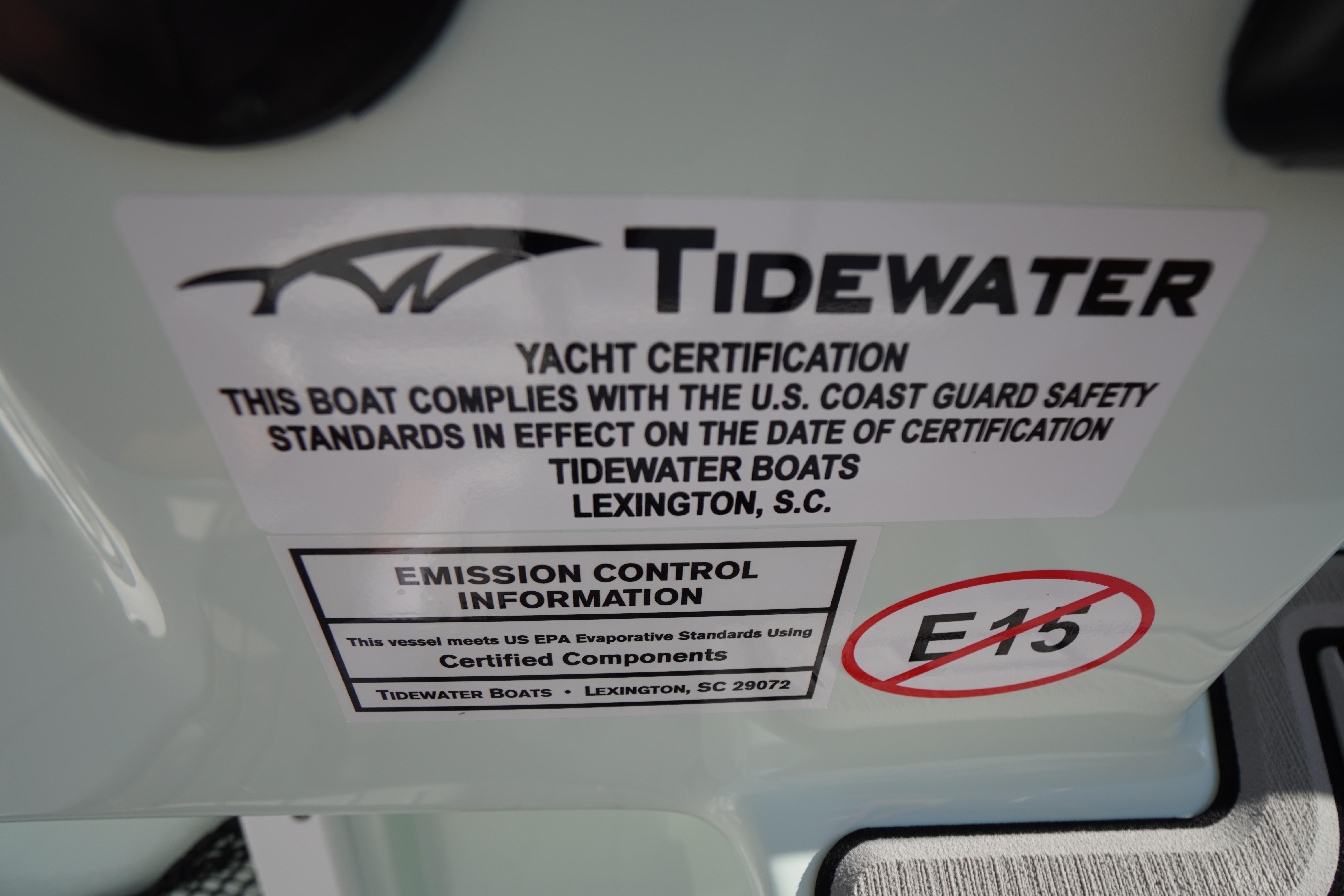 2026 Tidewater 272 LXF yacht certification label, U.S. Coast Guard safety compliance, emission control information.