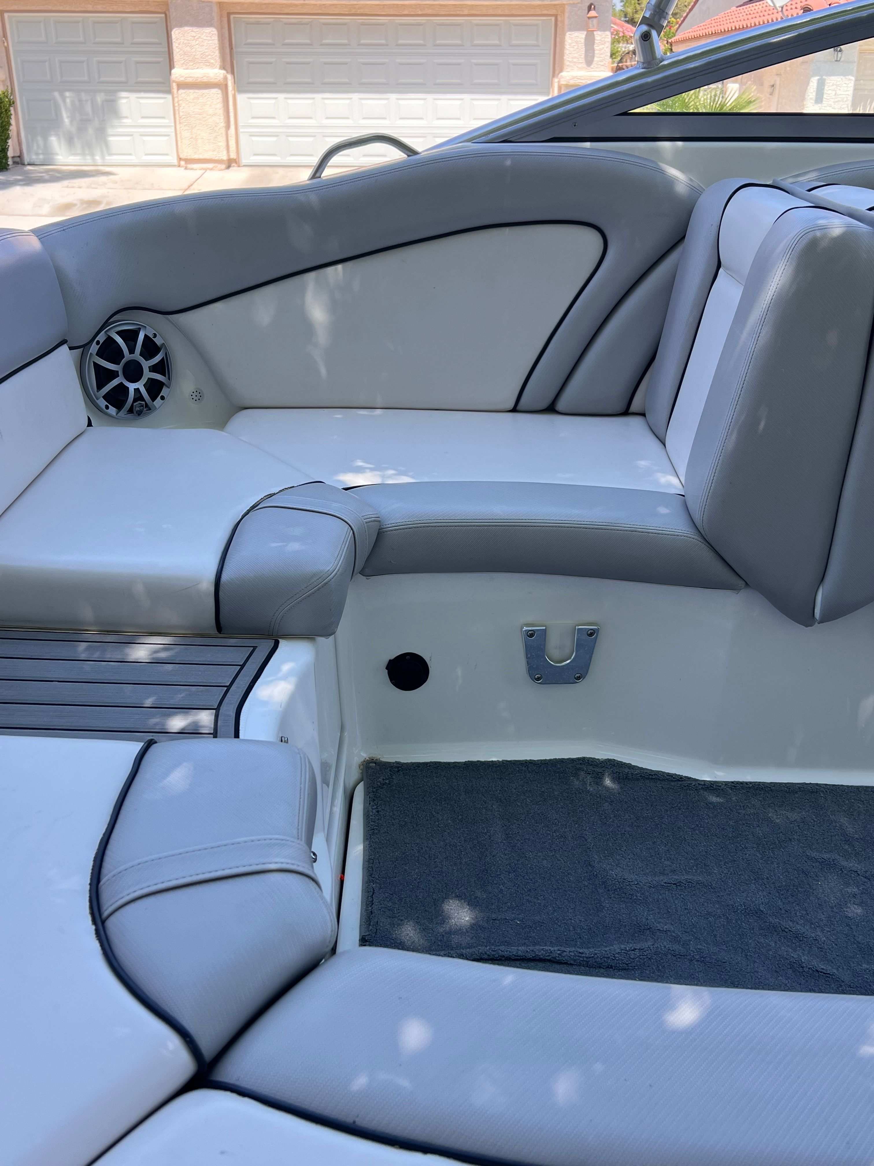 Interior of a 2011 Yamaha AR240 HO boat with gray seating.