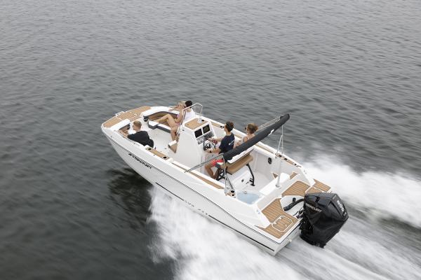 2025 Starcraft SVX 211 OB CC boat cruising on open water with passengers.