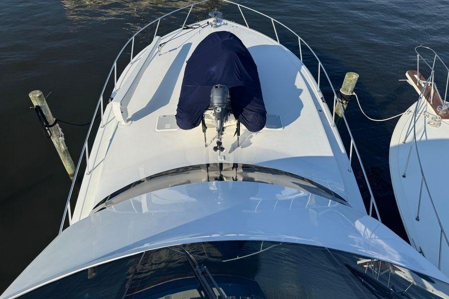 2002 Viking 61 Enclosed Bridge yacht docked, aerial view of bow and deck.