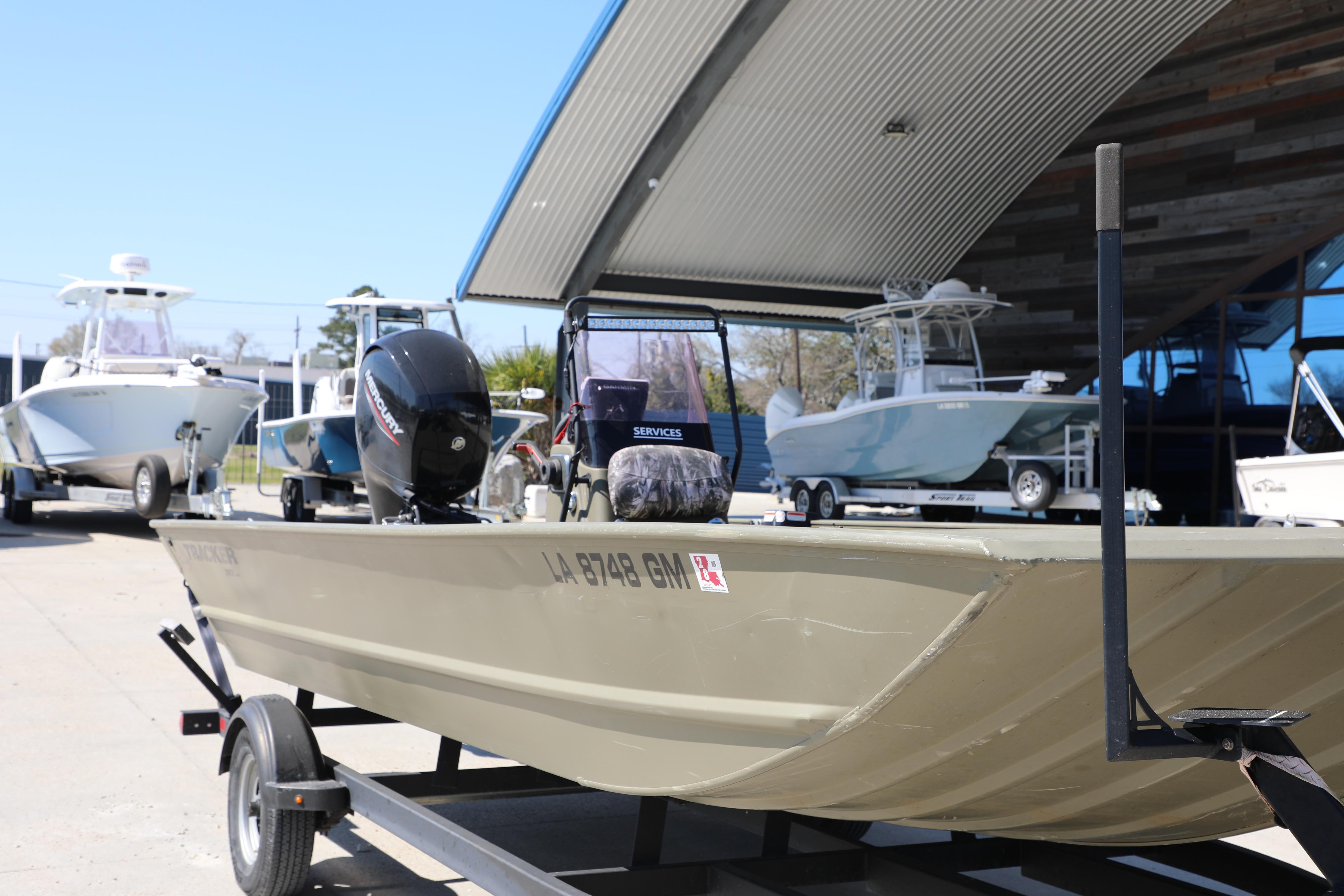 2021 Tracker Grizzly 2072 SC All-Welded boat on trailer, outdoor display.