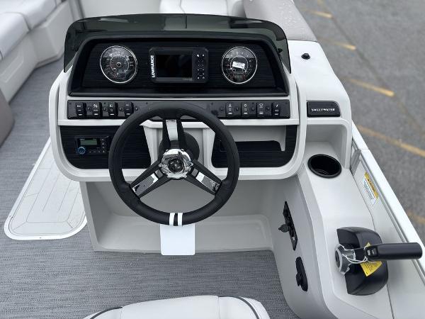 2025 Godfrey SWEETWATER 2286 SFL boat dashboard with steering wheel and controls.