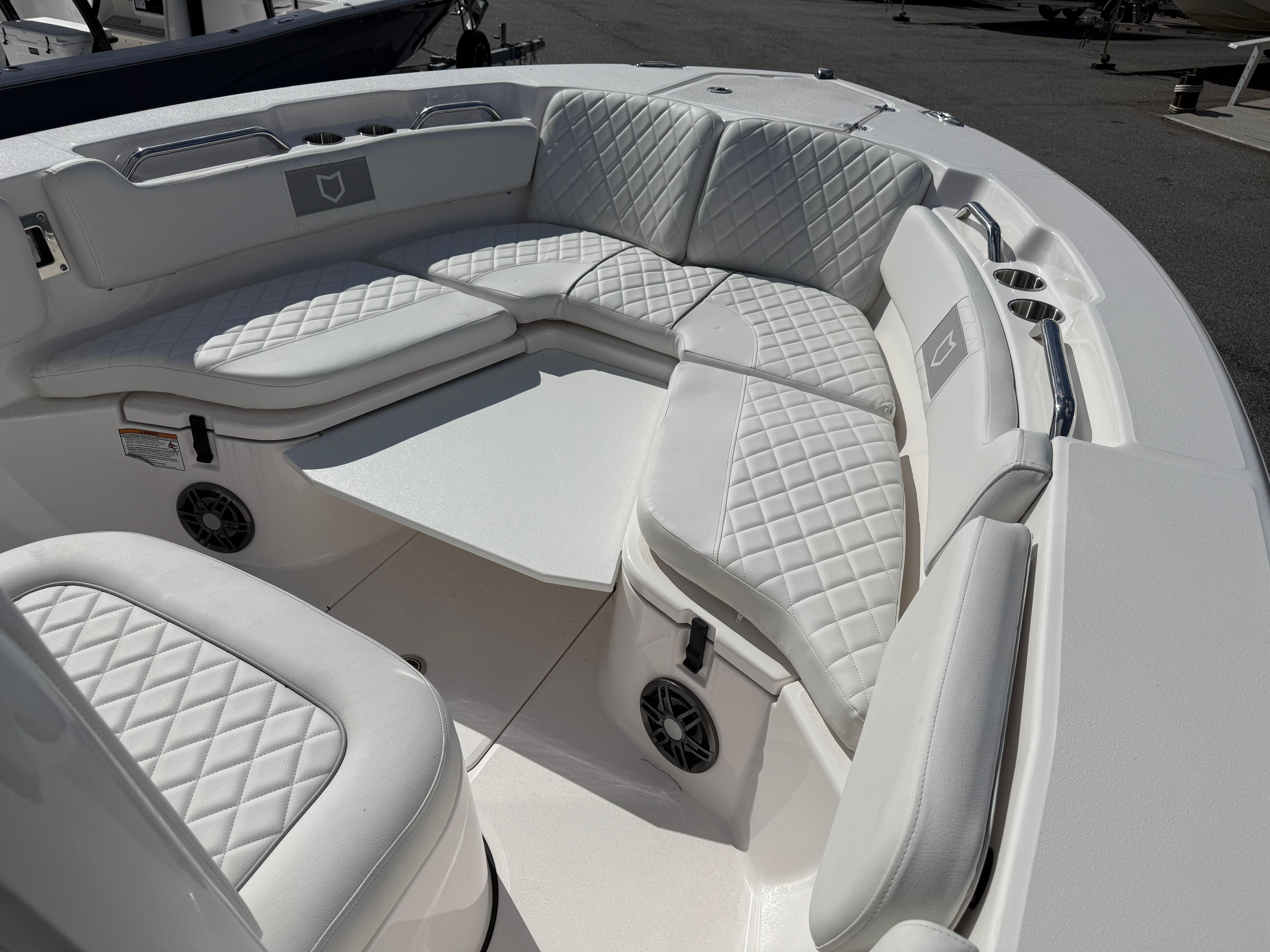 Luxurious seating area on 2026 Sea Fox 228 Commander boat with quilted upholstery.