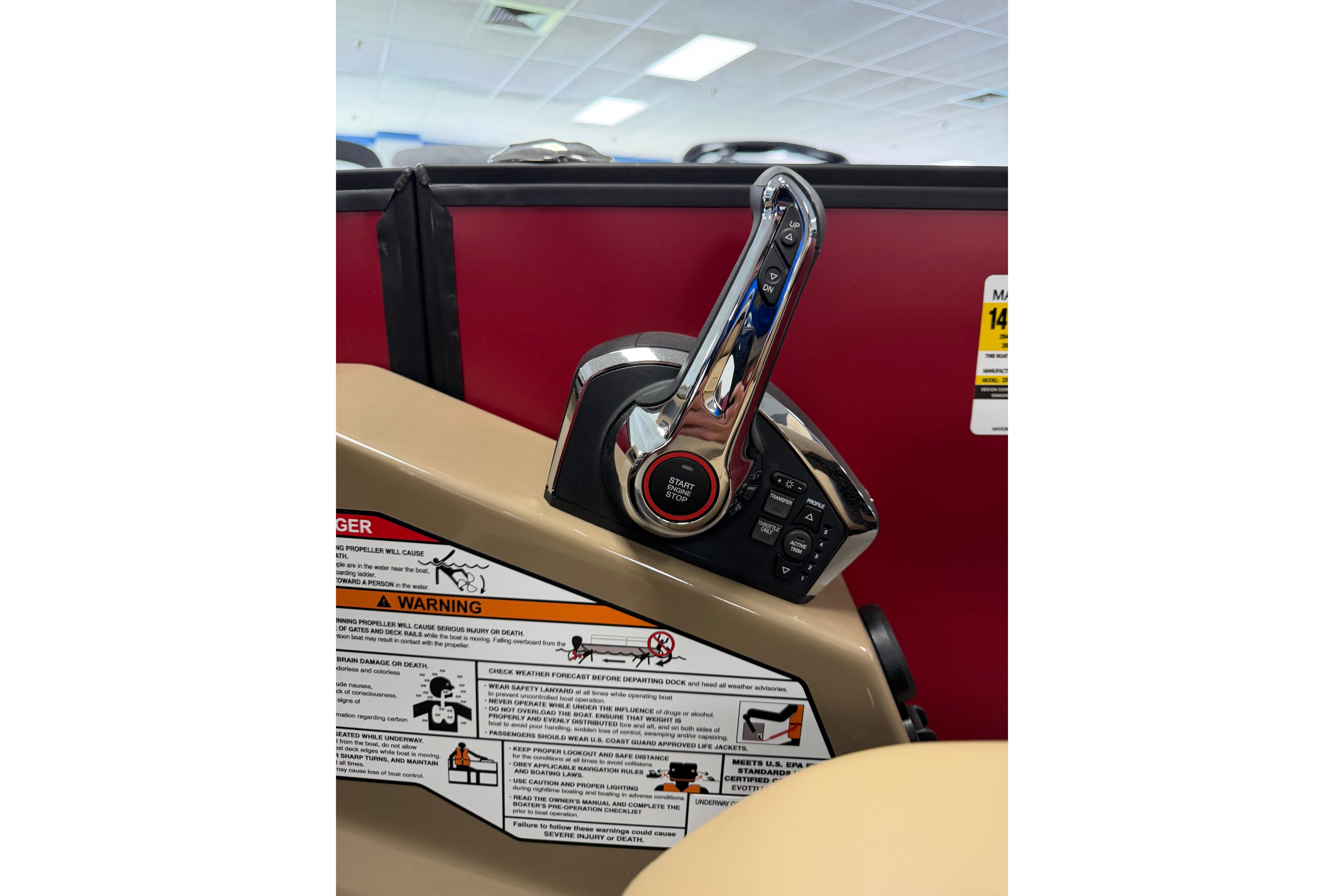 Control panel of 2026 Evotti 523CS boat with warning labels and start button.