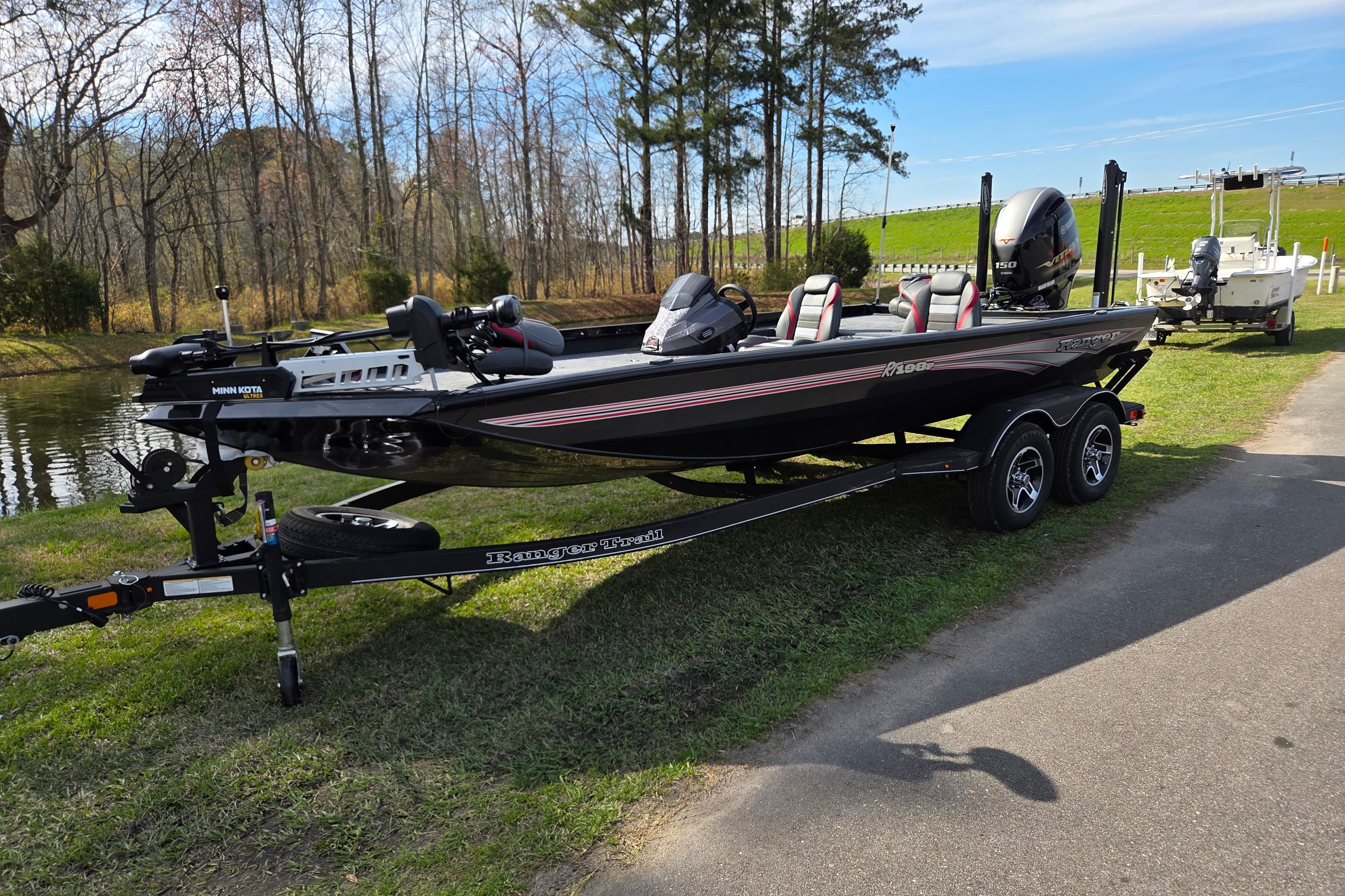 2026 Ranger RT198P boat on trailer parked by lakeside.