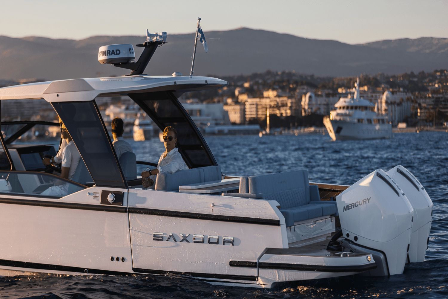 Saxdor SX320 GTO from 2027 on the water at sunset.