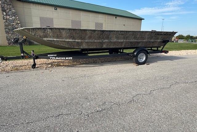 2026 Tracker Grizzly 2072 Utility boat on trailer, parked outdoors.