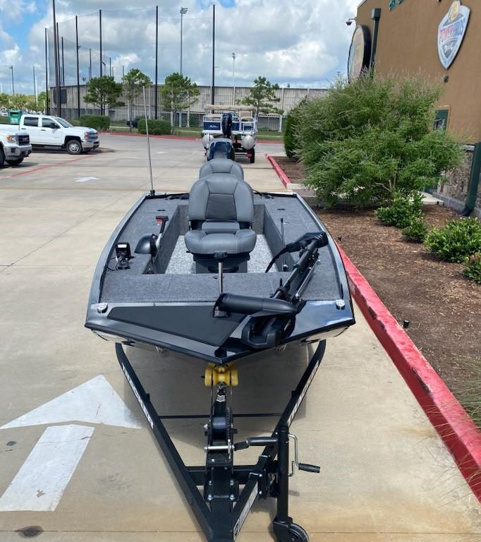 2025 Tracker Panfish 17 boat on trailer in parking lot, ready for fishing adventures.