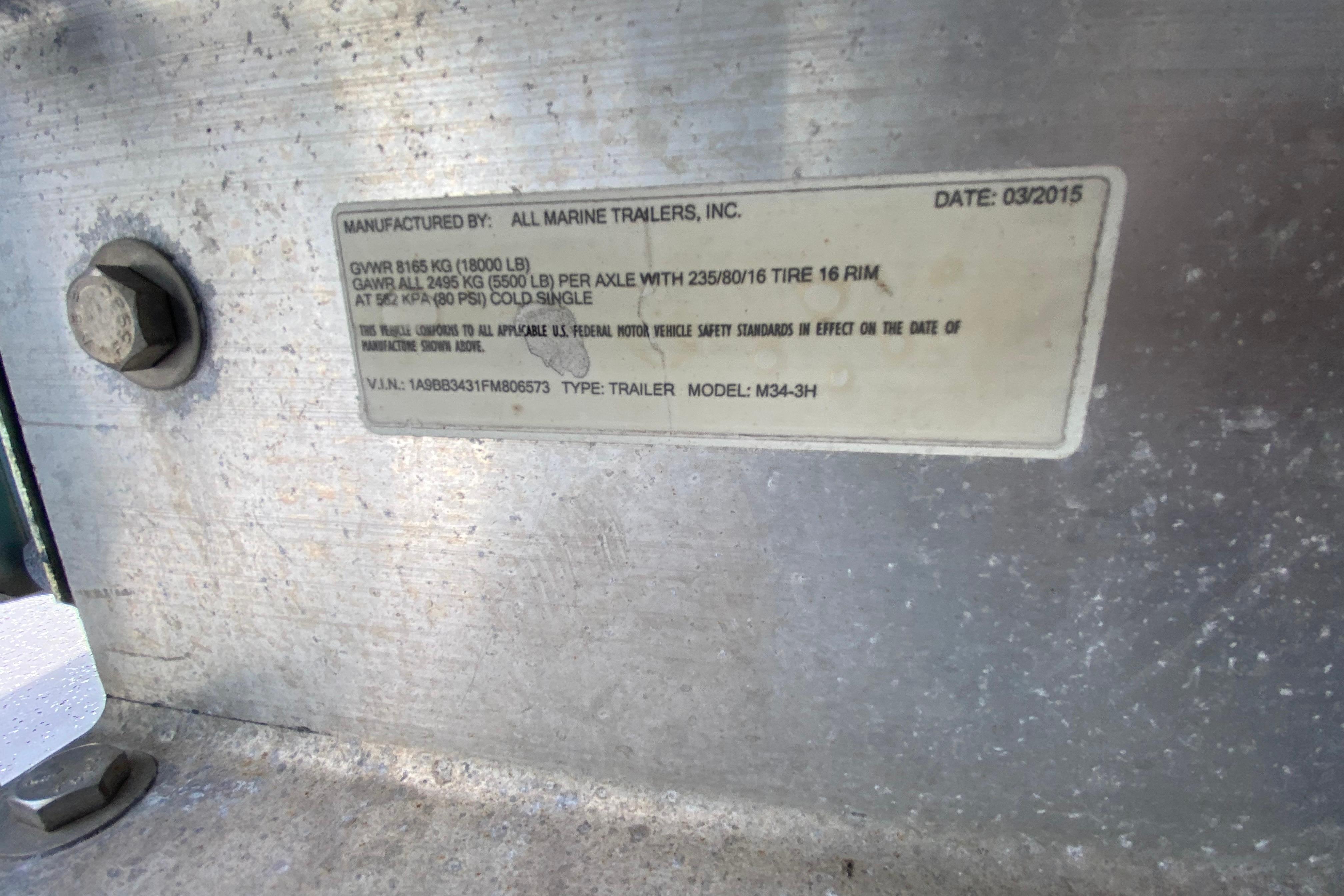 Label on trailer manufactured by All Marine Trailers, dated 03/2015, with specifications.