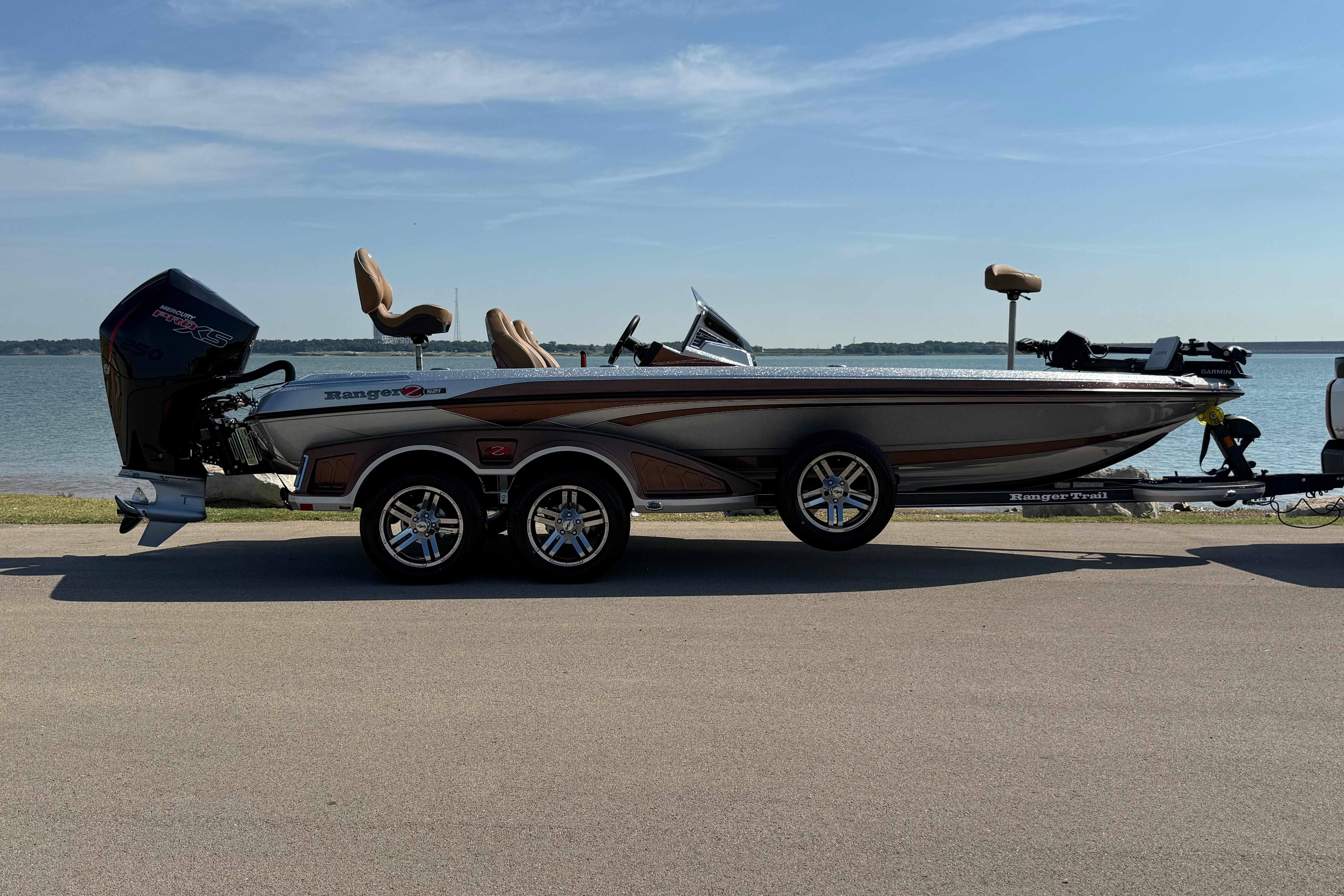 2026 Ranger Z521R boat parked by a lake, showcasing sleek design and modern features.