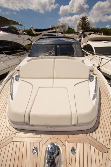 2024 Princess V55 yacht with sleek design and luxurious deck, under a bright blue sky.