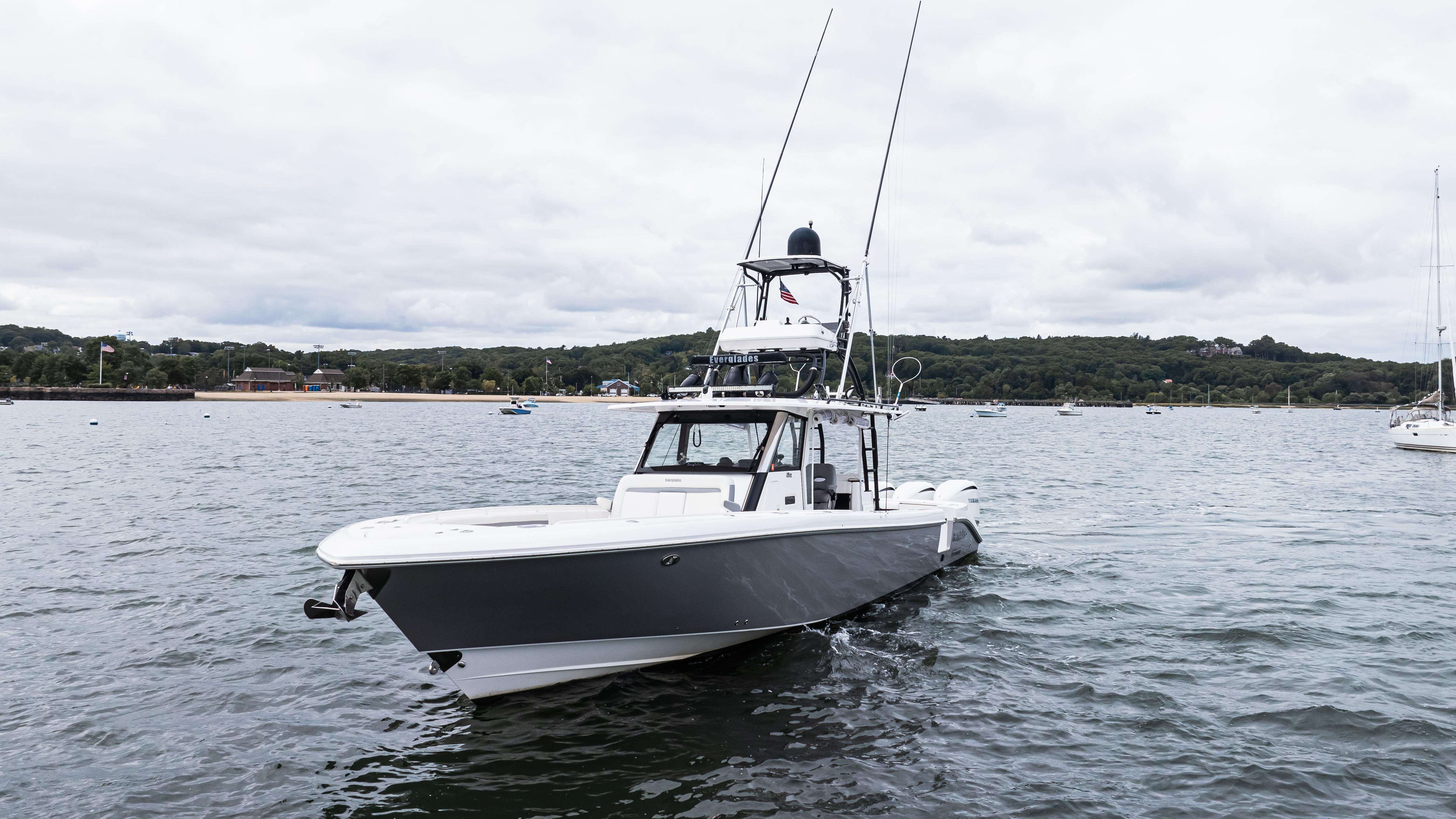 2017 Everglades 435 CC boat on calm water, overcast sky in the background.