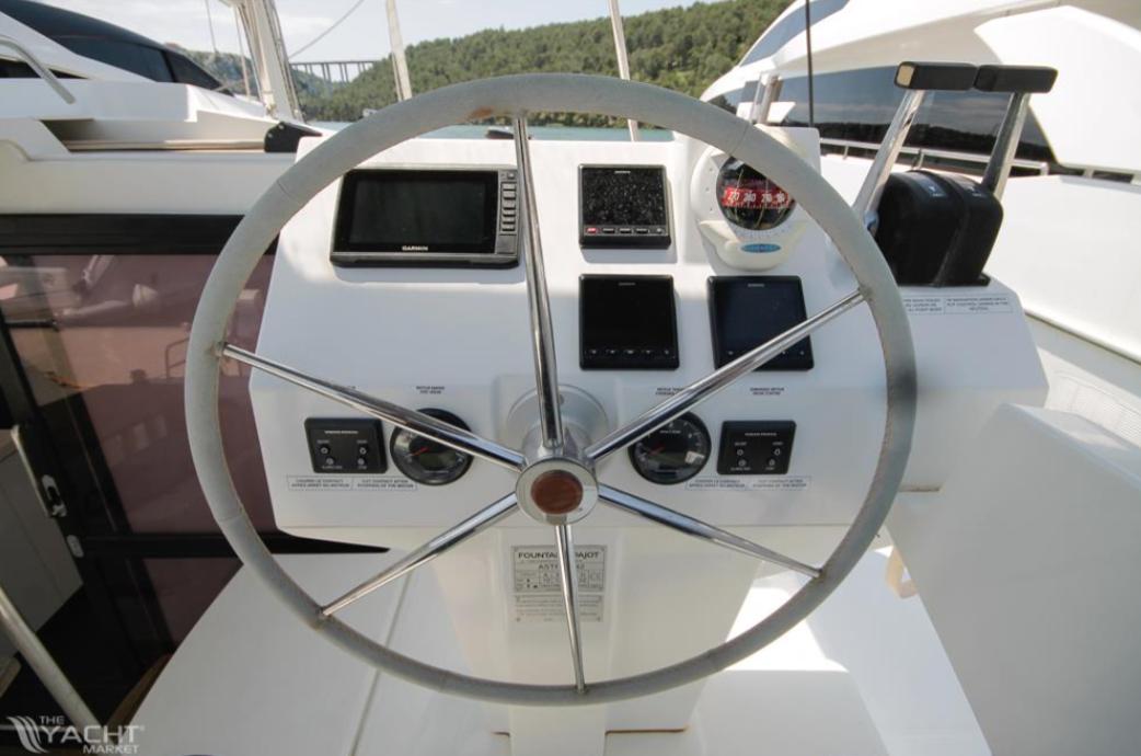 Helm of 2023 Fountaine Pajot Catamaran Astrea 42 with navigation instruments.
