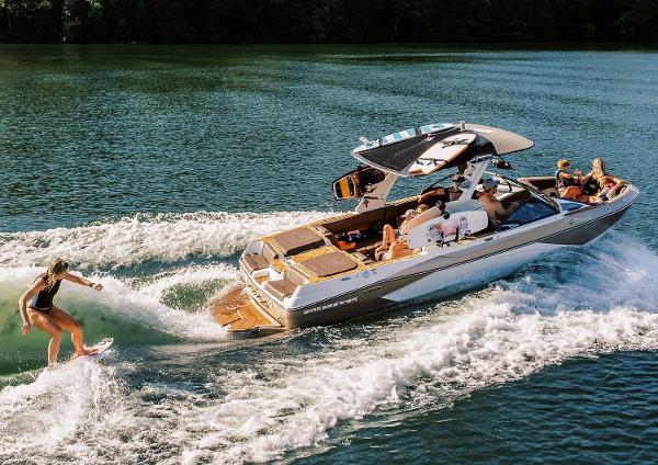 Manufacturer Provided Image: 2025 Malibu Wakesetter 23 LSV towing a wakeboarder on a sunny lake.