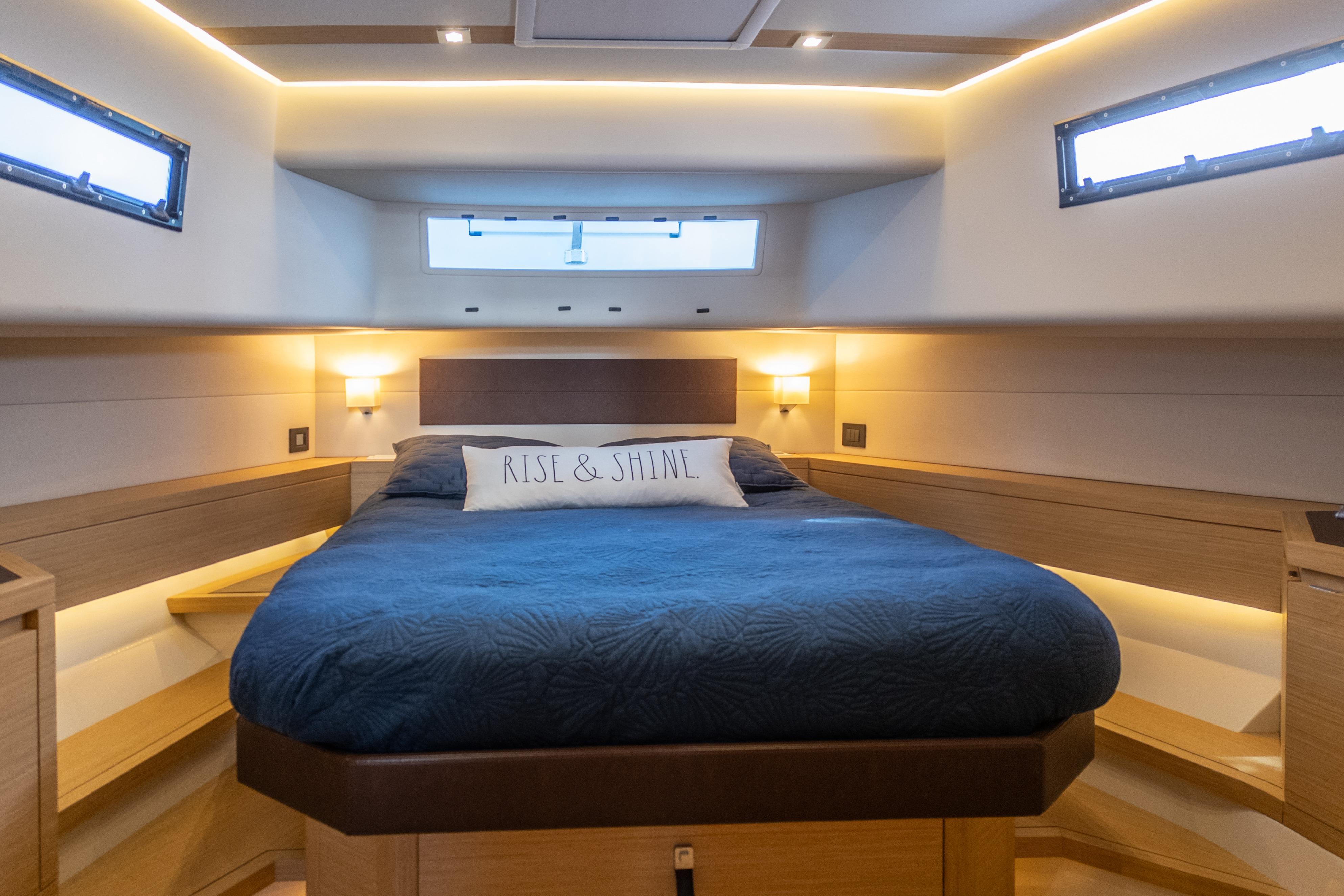 Luxurious cabin interior of 2019 Pardo Yachts P50 with cozy bed and ambient lighting.