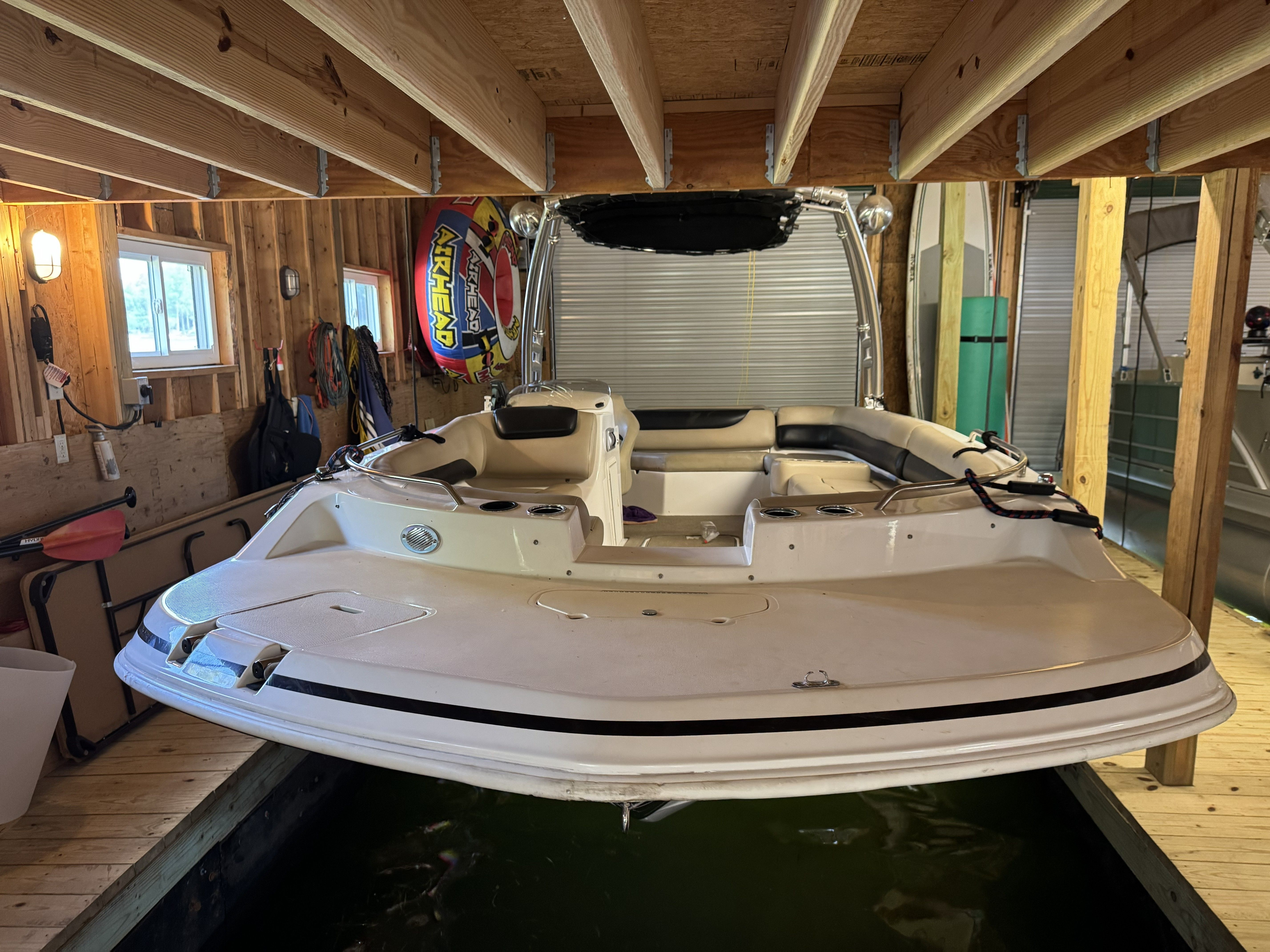 A 2014 Hurricane SS201 I/O boat in a covered dock.