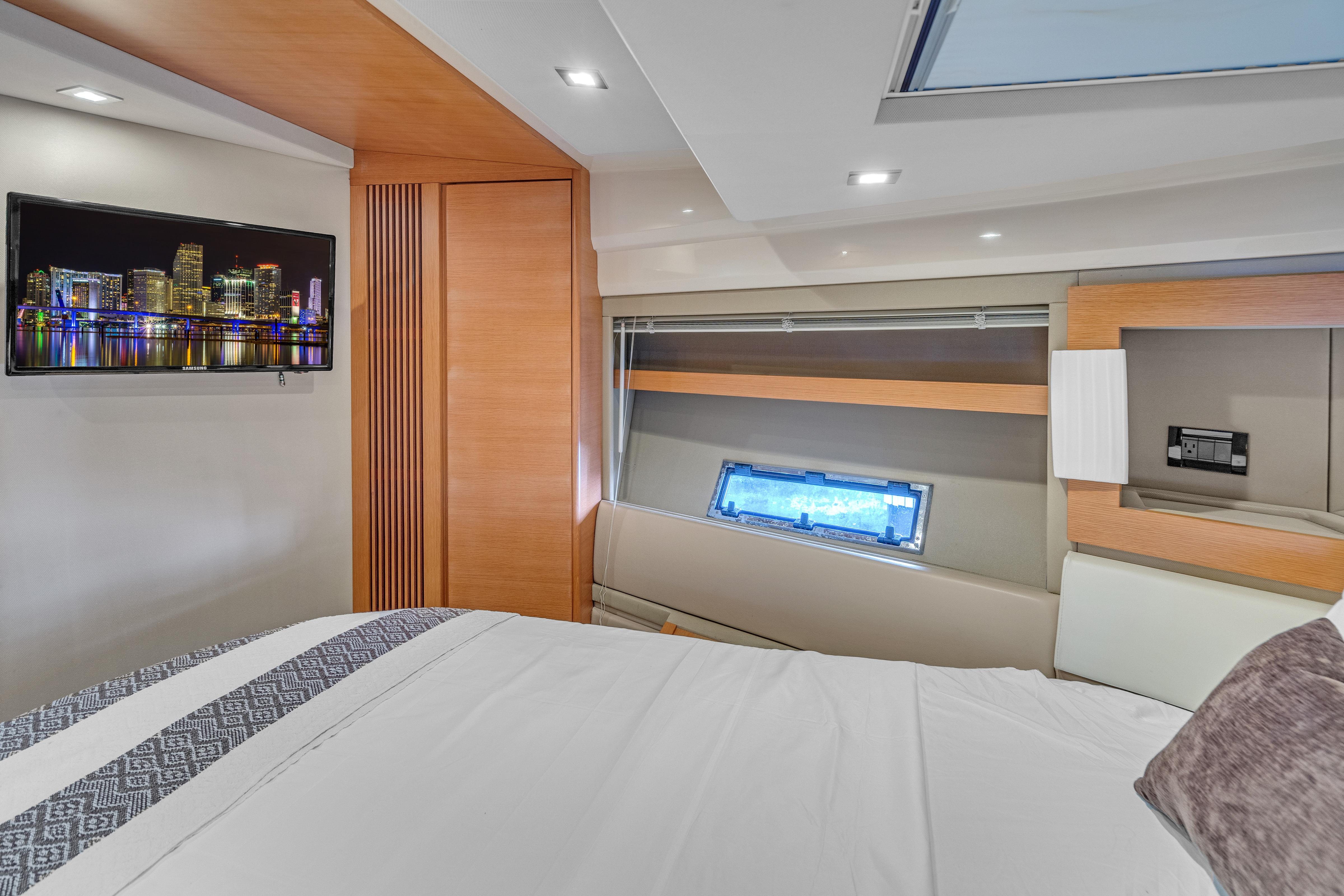 Luxurious interior of 2013 Azimut 45 Flybridge yacht with modern decor and cityscape artwork.