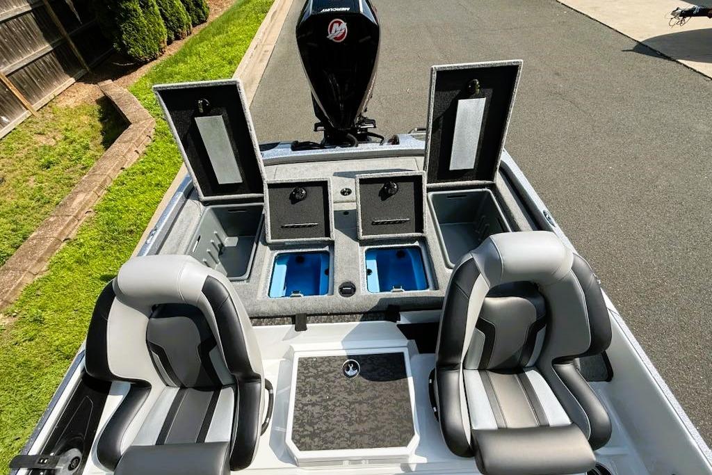 2025 Nitro Z21 XL Pro boat interior with open storage compartments and two seats.
