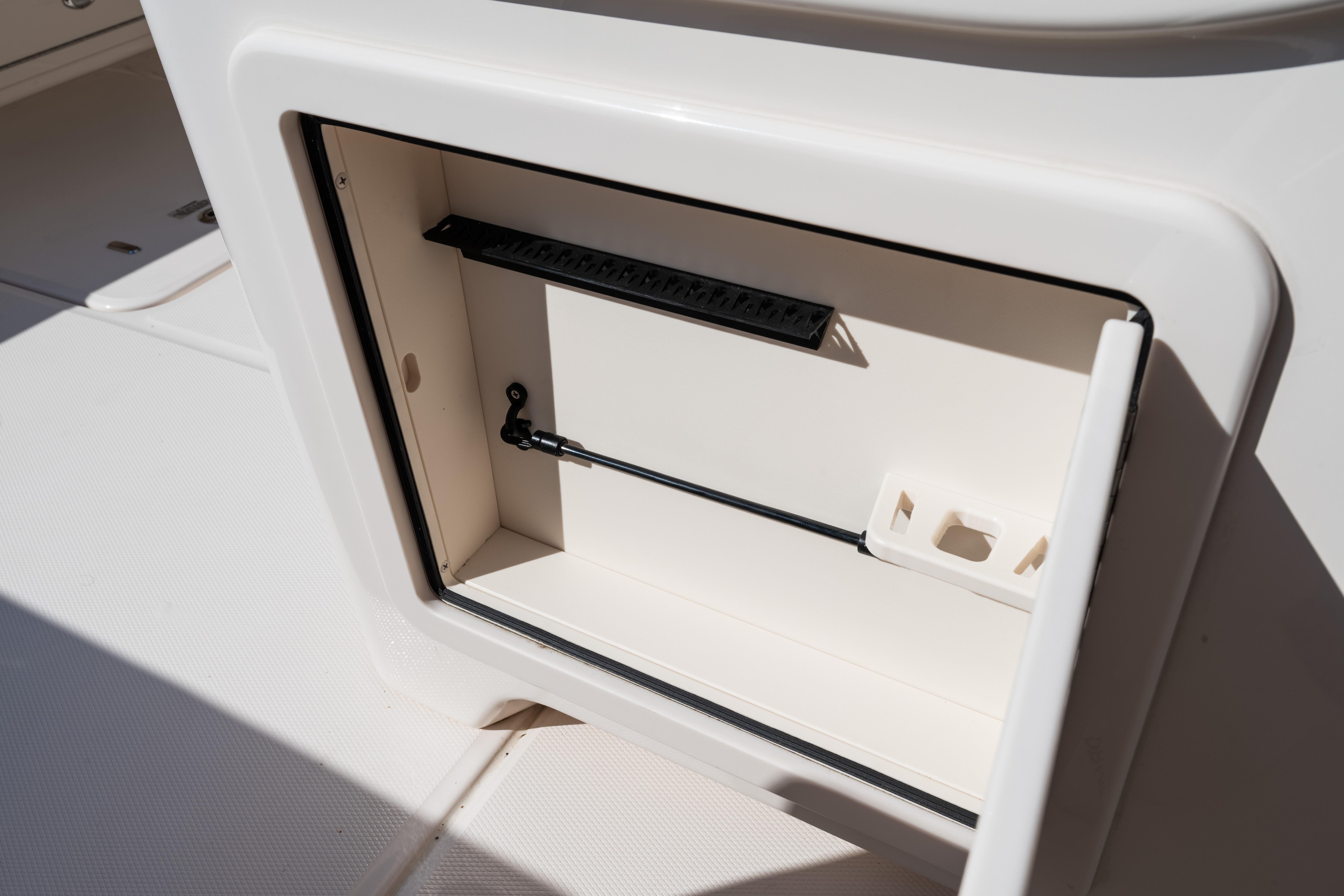 Open storage compartment on 2025 Grady-White Canyon 386 boat.