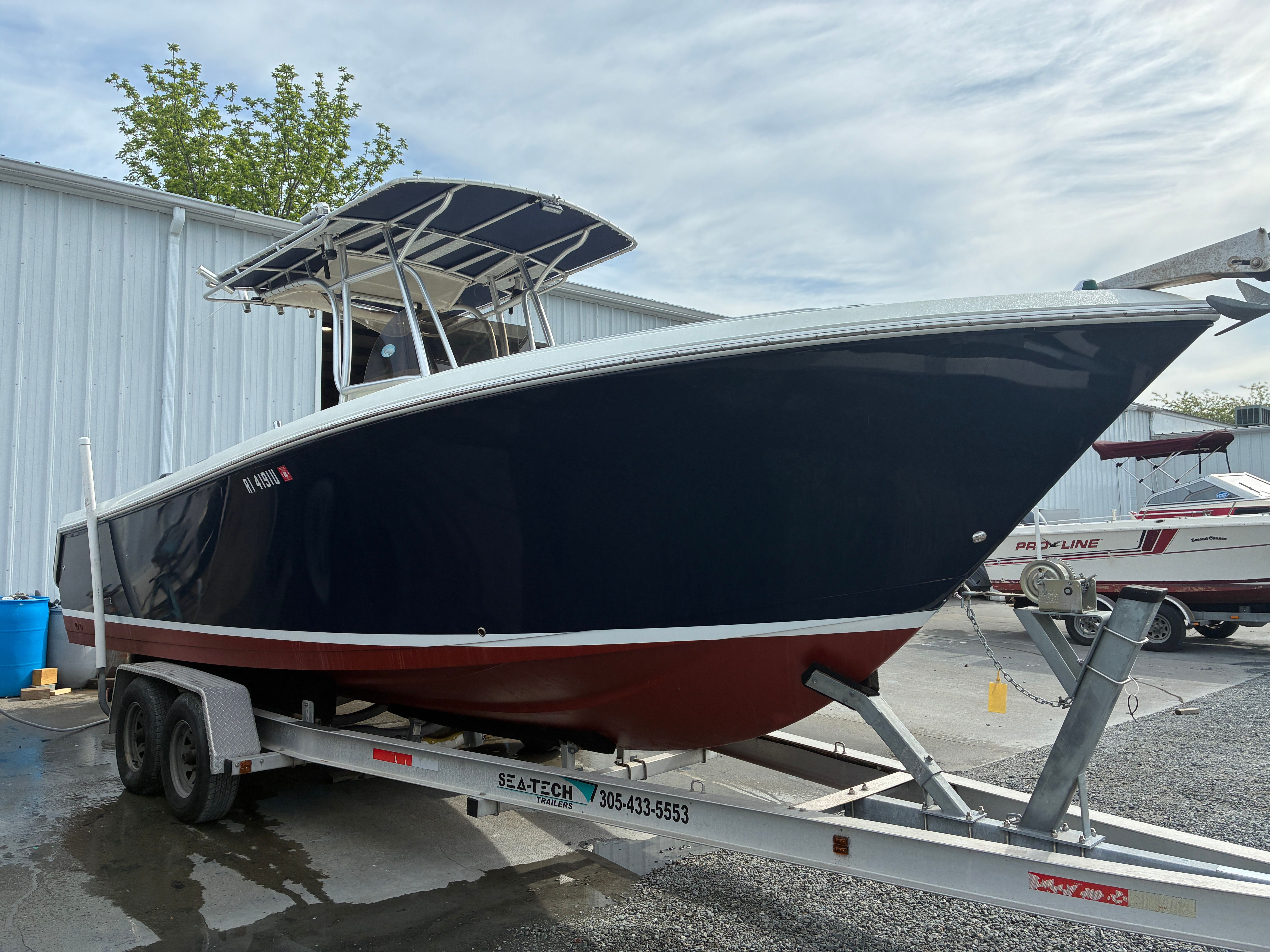 2007 Sailfish 2660 boat on trailer outside storage facility.
