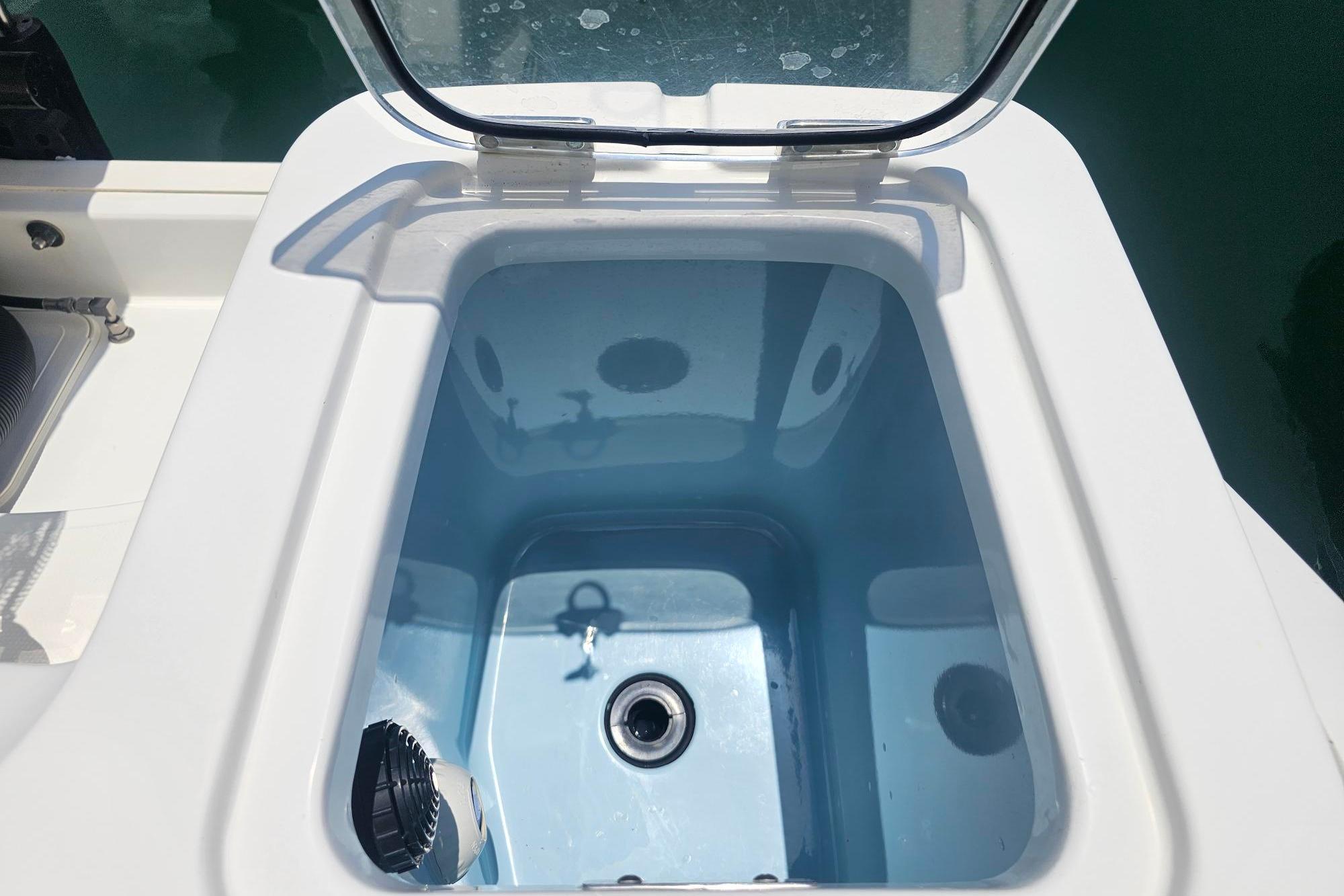 Livewell on a 2017 Boston Whaler 230 Outrage boat, open and ready for use.