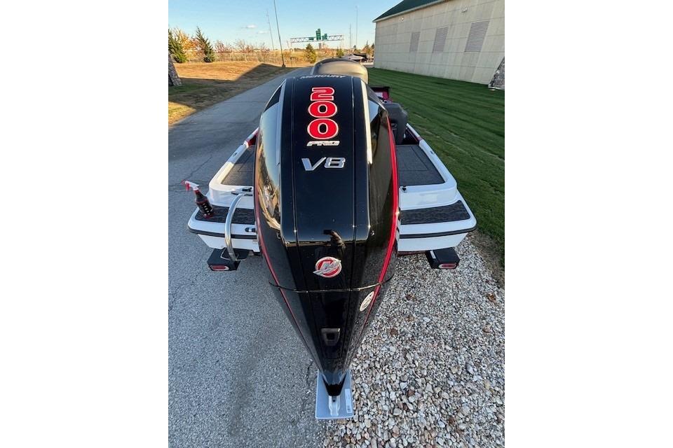 2026 Nitro Z19 XL Pro boat with powerful 200 Pro V8 engine, parked on gravel.