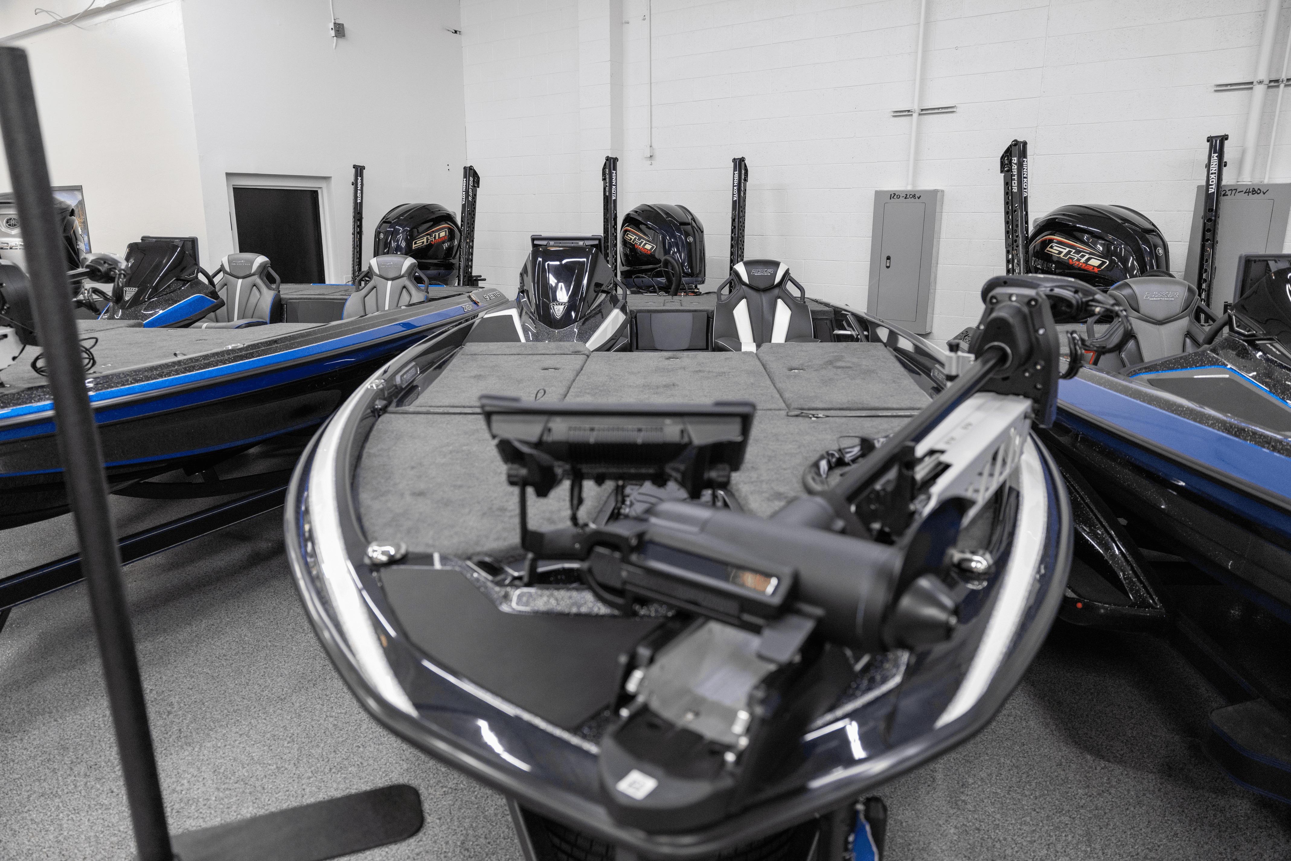 2026 Skeeter FXR21 FLEX boat in showroom, featuring advanced fishing technology.