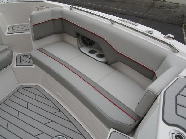 Luxurious seating on 2025 Solara S-250 CW boat with modern design and cup holders.