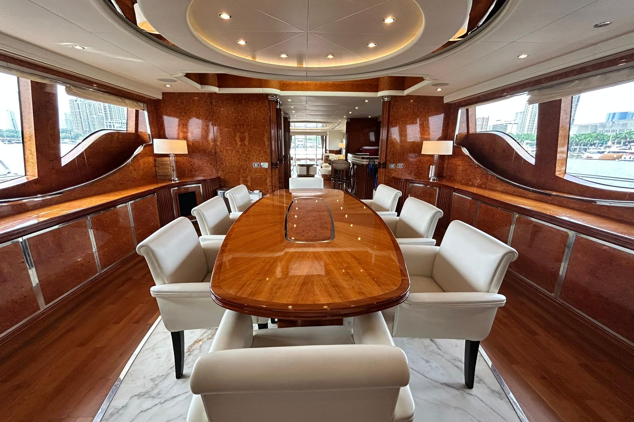 Luxurious interior of 2010 Versilcraft Euroyacht Planet 125S Hardtop with elegant dining area.