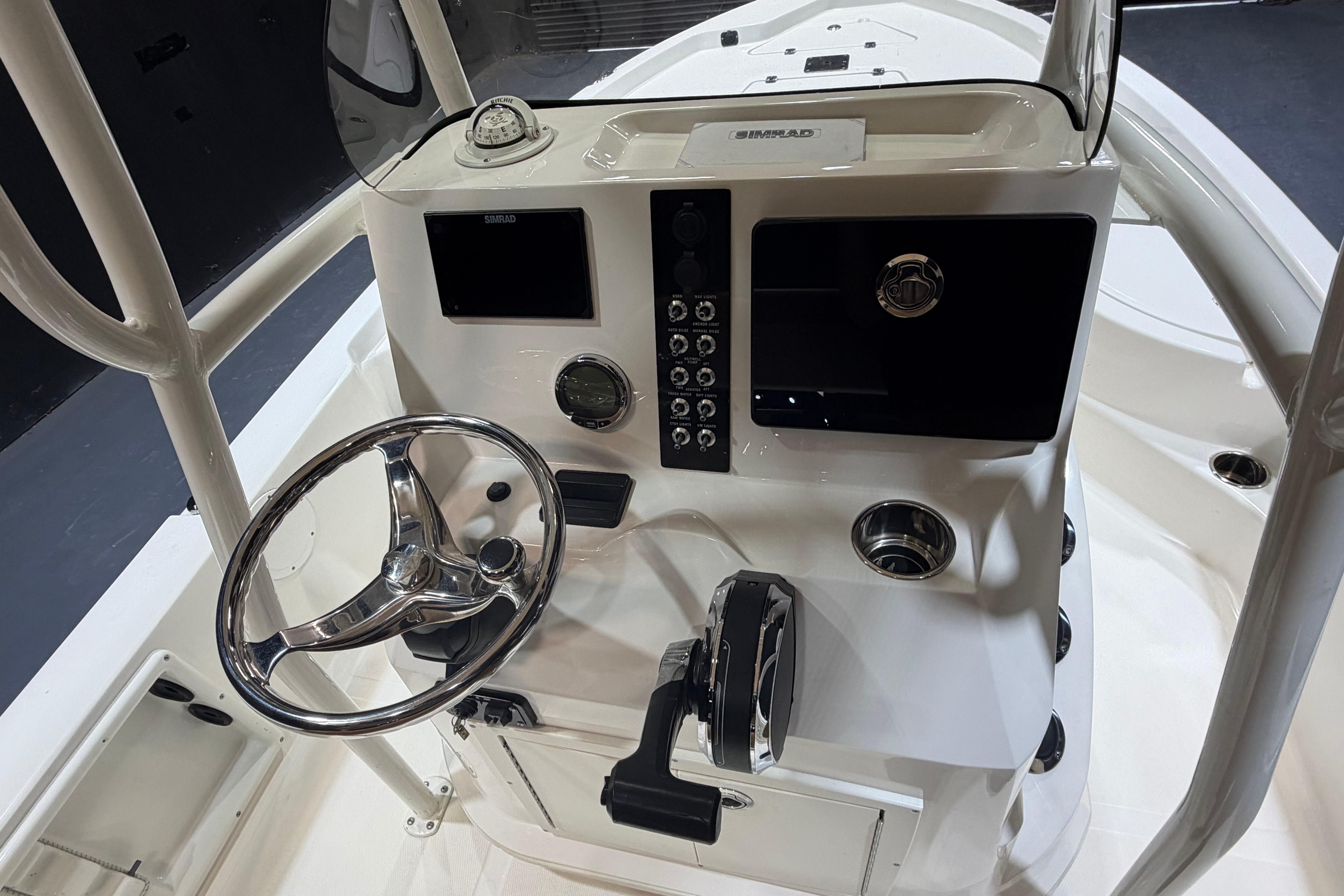 2023 NauticStar 215 XTS boat console with steering wheel and control panel.