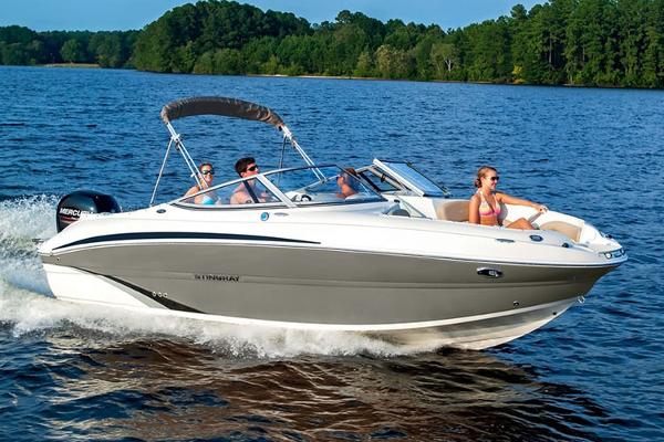 Manufacturer Provided Image: 2018 Stingray 214 LR boat cruising on a lake with passengers.