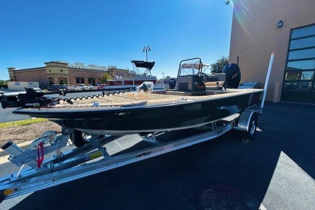2026 Mako 18 Pro Skiff Backwater Edition on trailer, parked outdoors in sunny setting.
