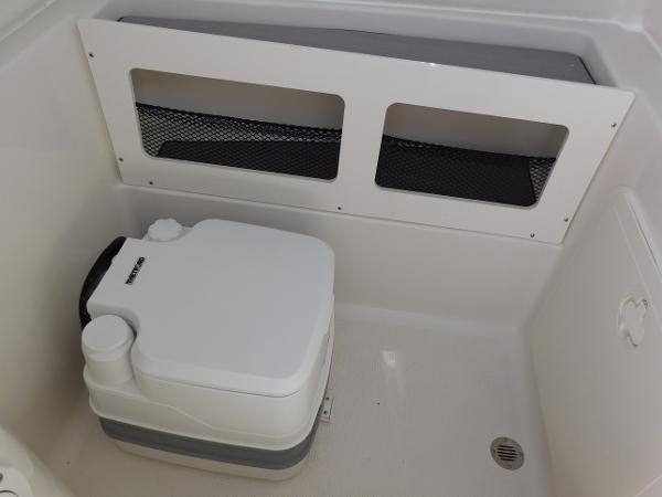 Portable toilet in 2024 Sailfish 242 CC boat.