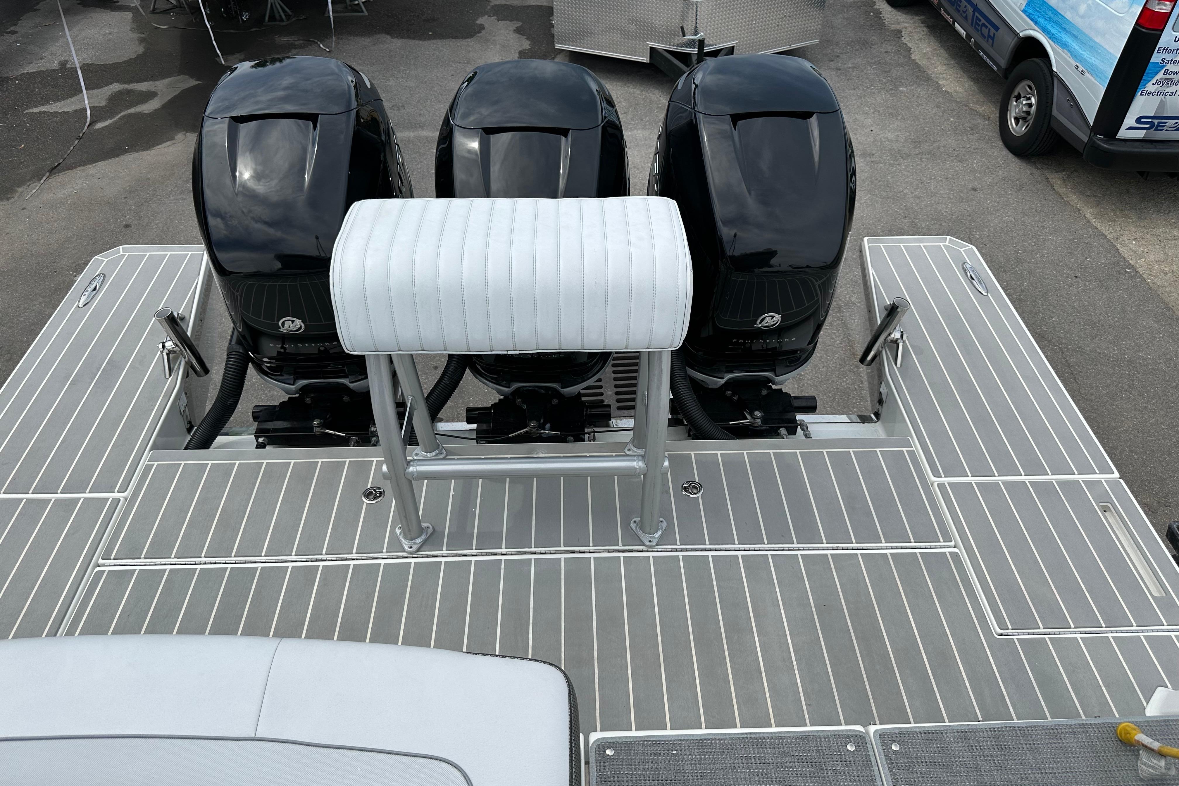 2021 Formula 380 Super Sport Crossover OB with triple outboard engines on deck.