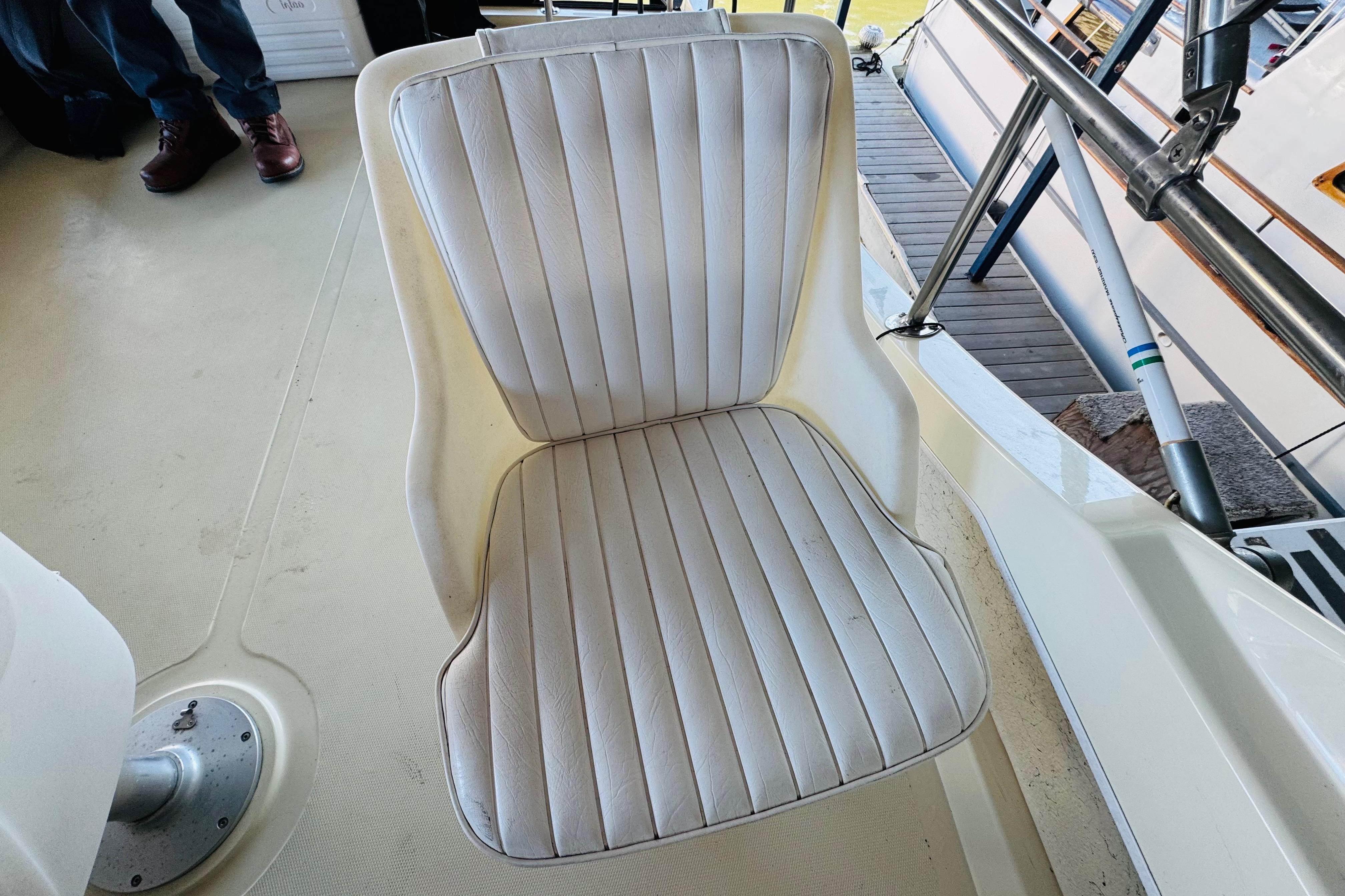 White cushioned seat on 2004 Camano 31 Troll boat deck.