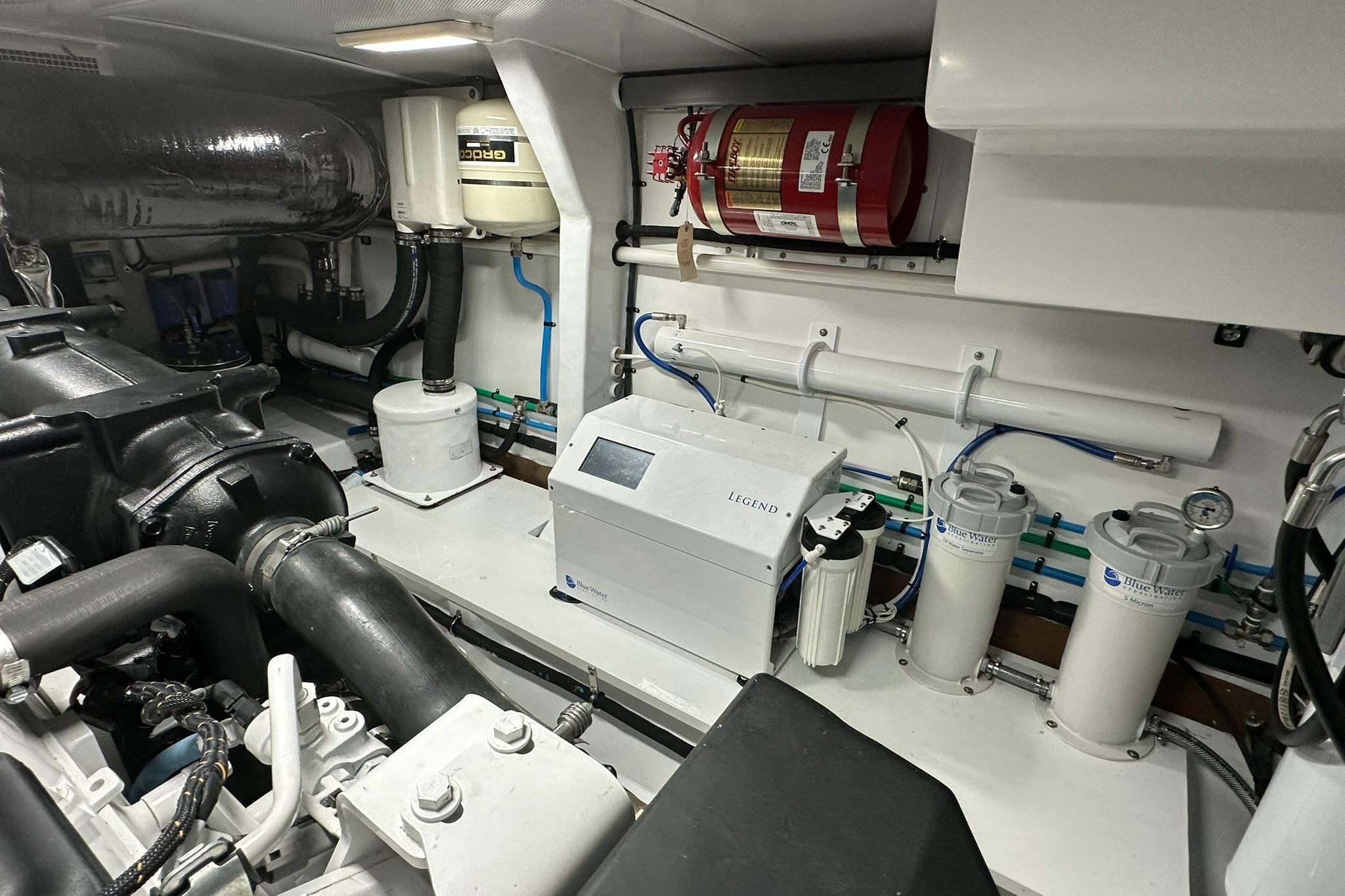 Engine room of 2023 Marlow Explorer 66E-CB yacht with advanced filtration systems.